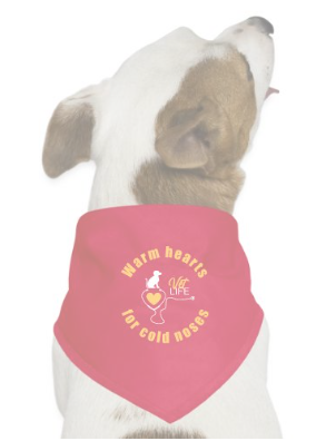 Dog wearing a pink bandana with the text 'Warm Hearts for Cold Noses' and a heart with a paw print.