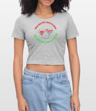 Gray crop top t-shirt with a 'Nurse Life' design., worn by a woman with curly hair, paired with blue jeans.