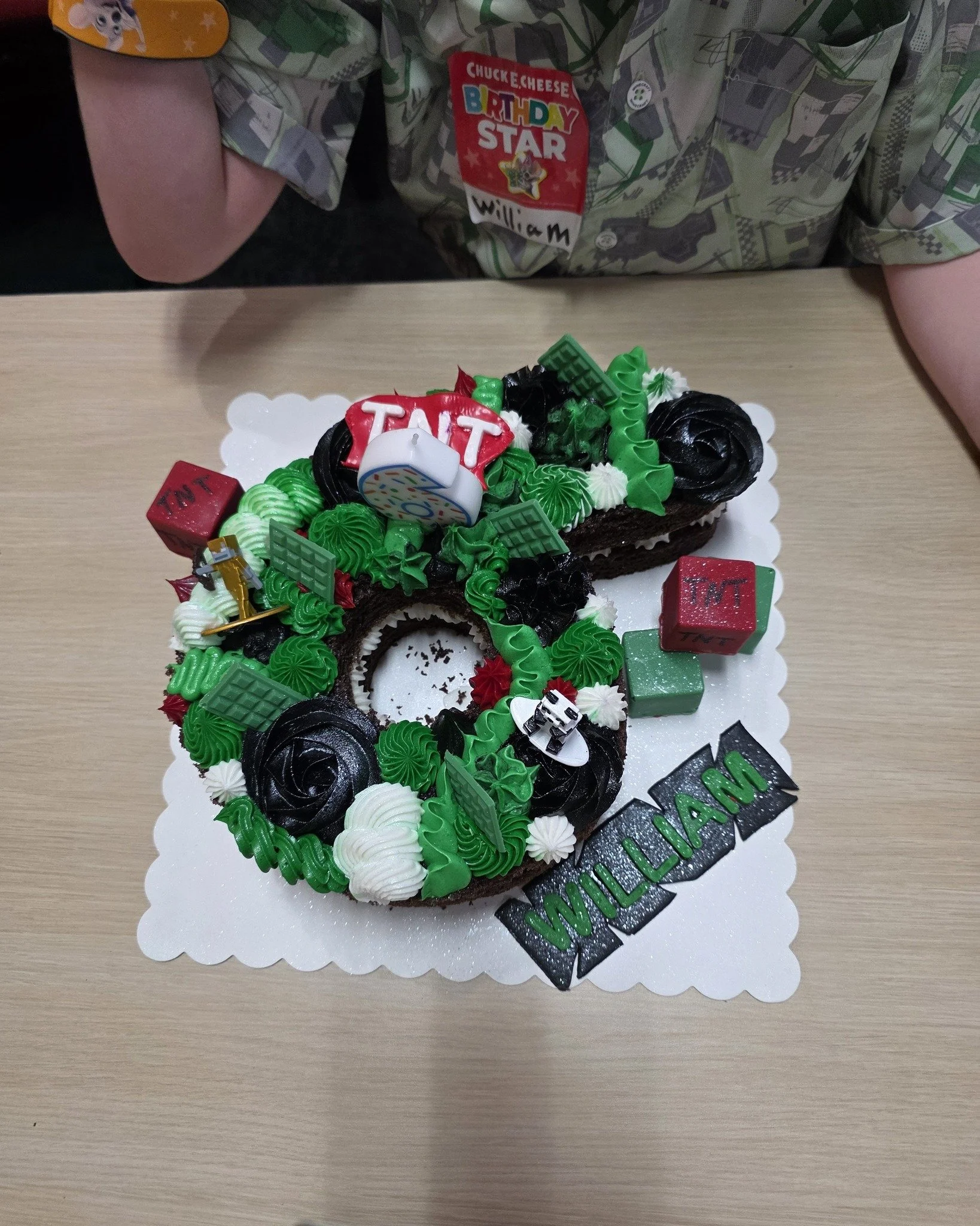 🎮🧱 This order was for a very special 6-year-old!

We made 2 Minecraft-themed #6 cakes &mdash; one vanilla and one chocolate &mdash; both covered in deliciously smooth buttercream frosting. Off to the side, we added TNT block cake pops with fun choc
