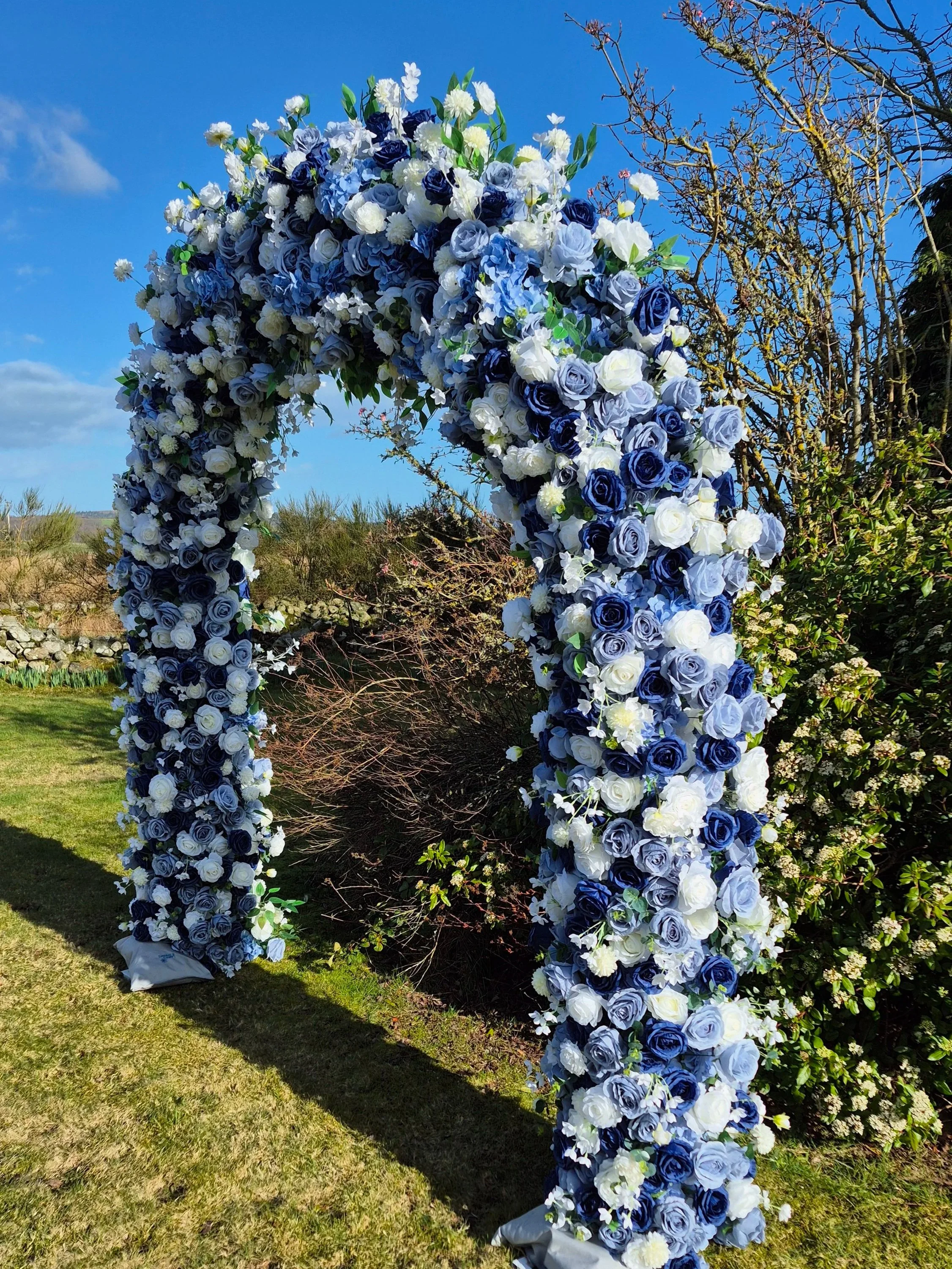 Navy blue, dusky blue and white floral full arch