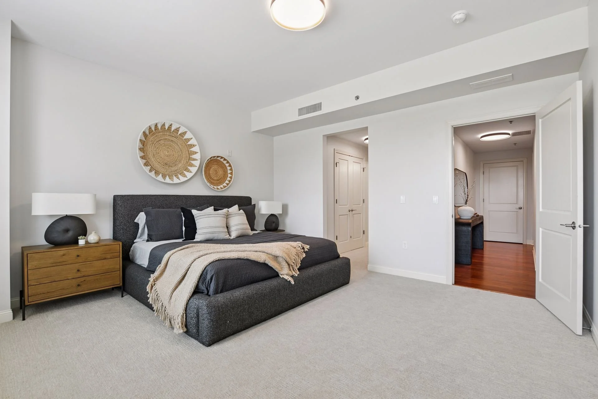 Modern bedroom with white walls.
