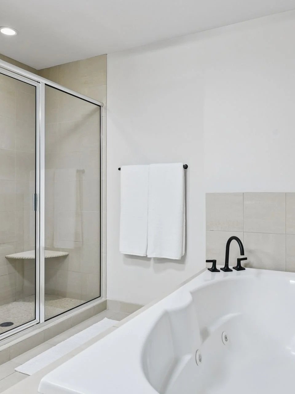 Spacious Bathroom with Separate Tub and Shower