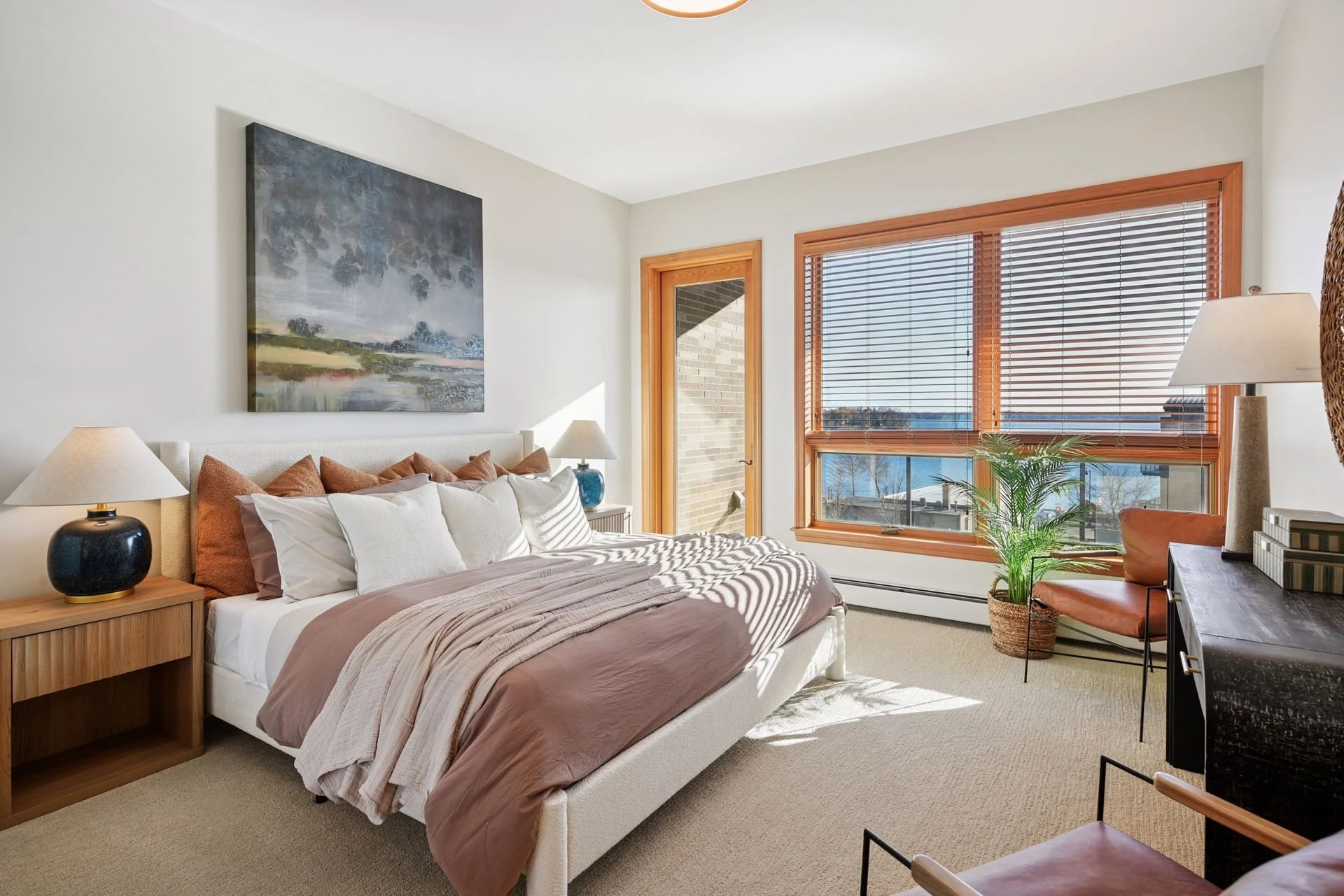 Bright bedroom with large windows.