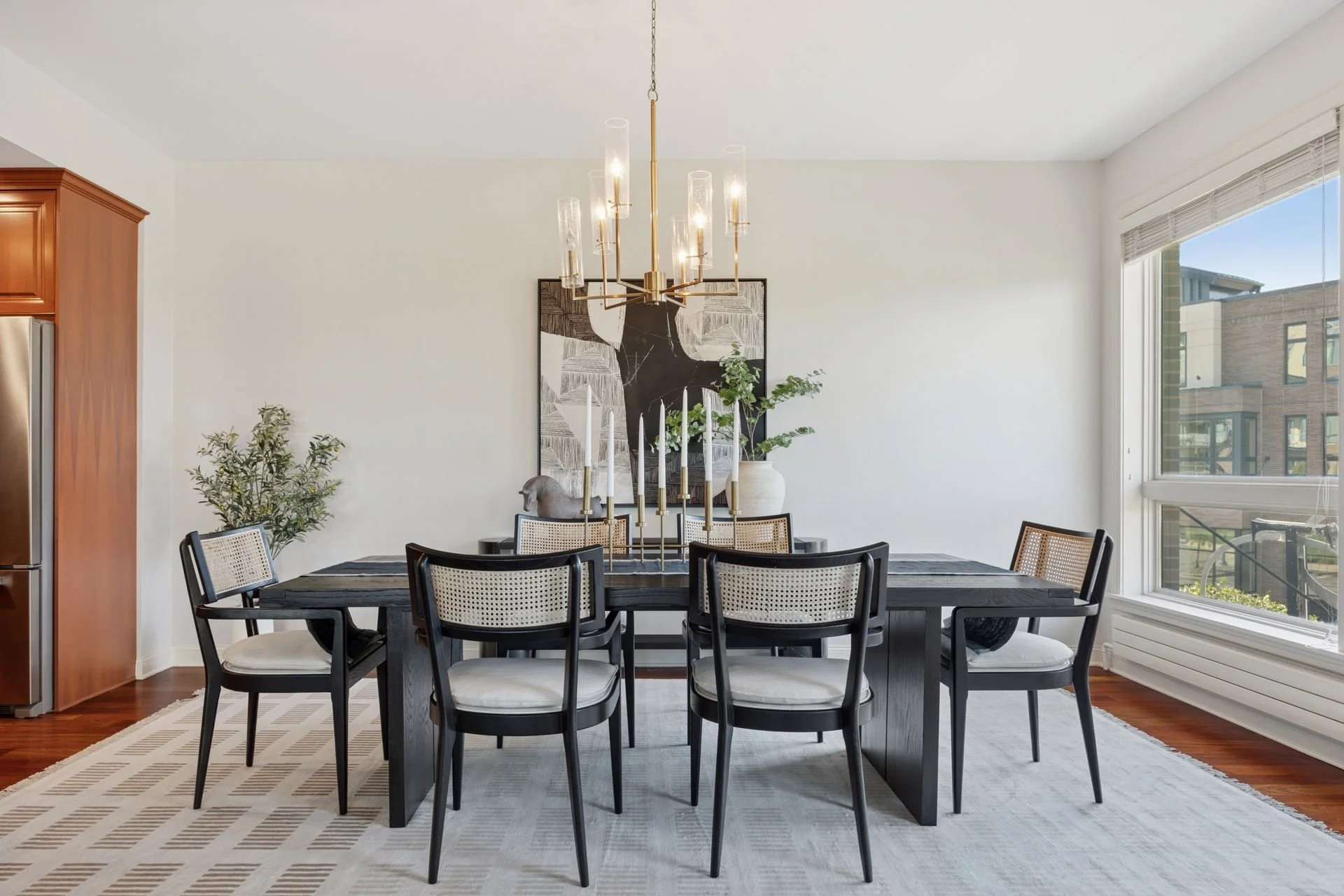 Modern dining room with a large window.