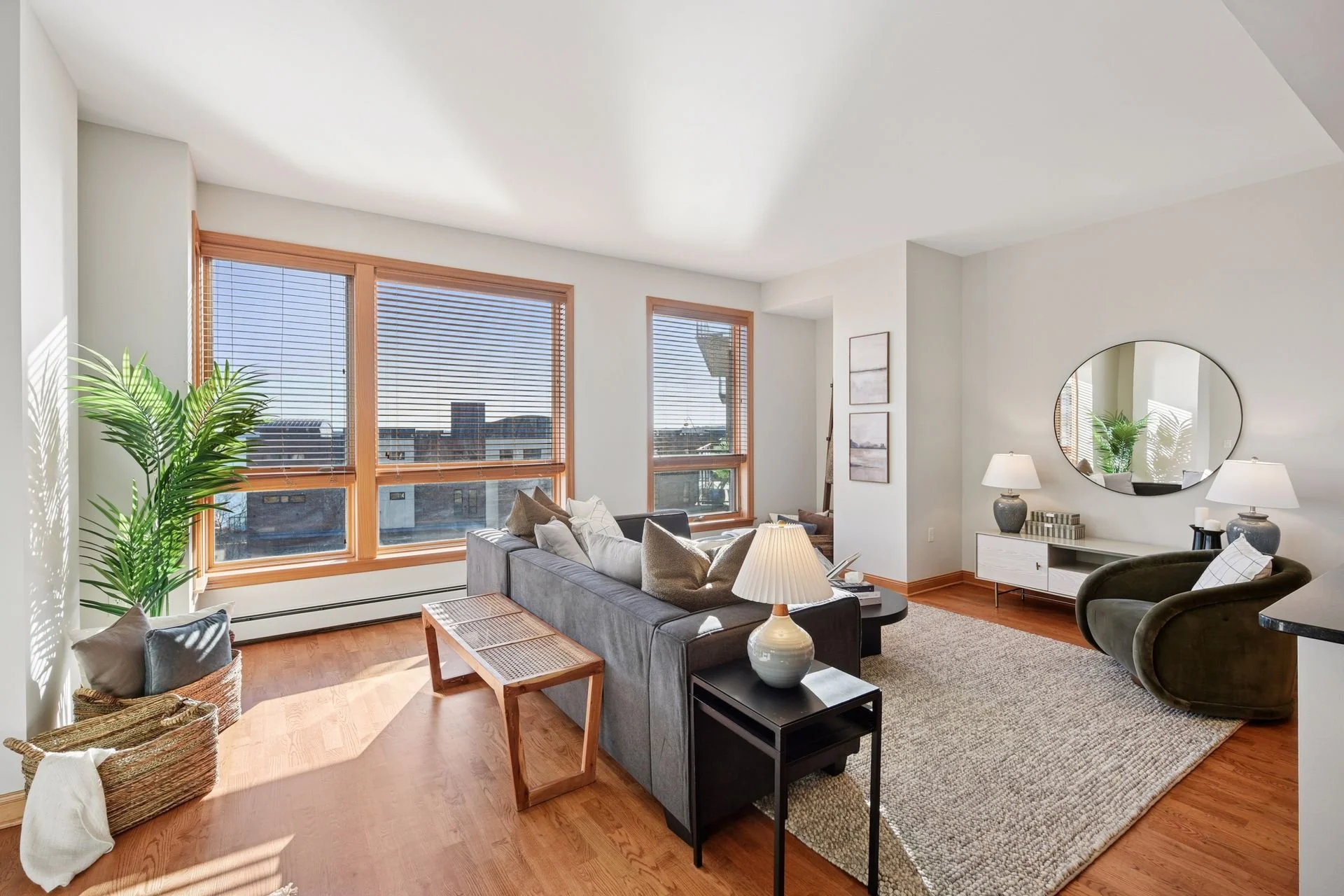 Living room with large windows and hardwood flooring.