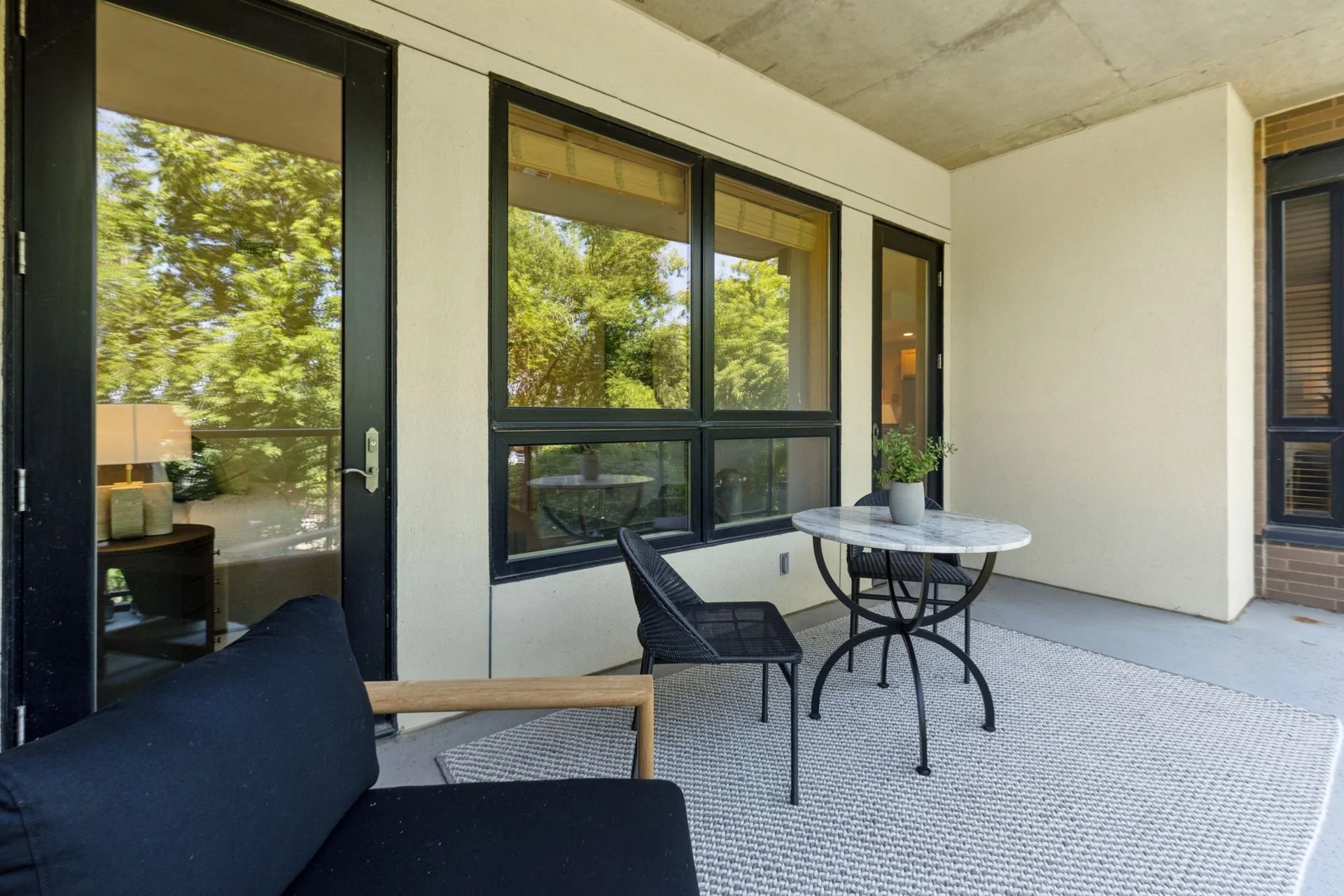 Outdoor balcony overlooking trees.