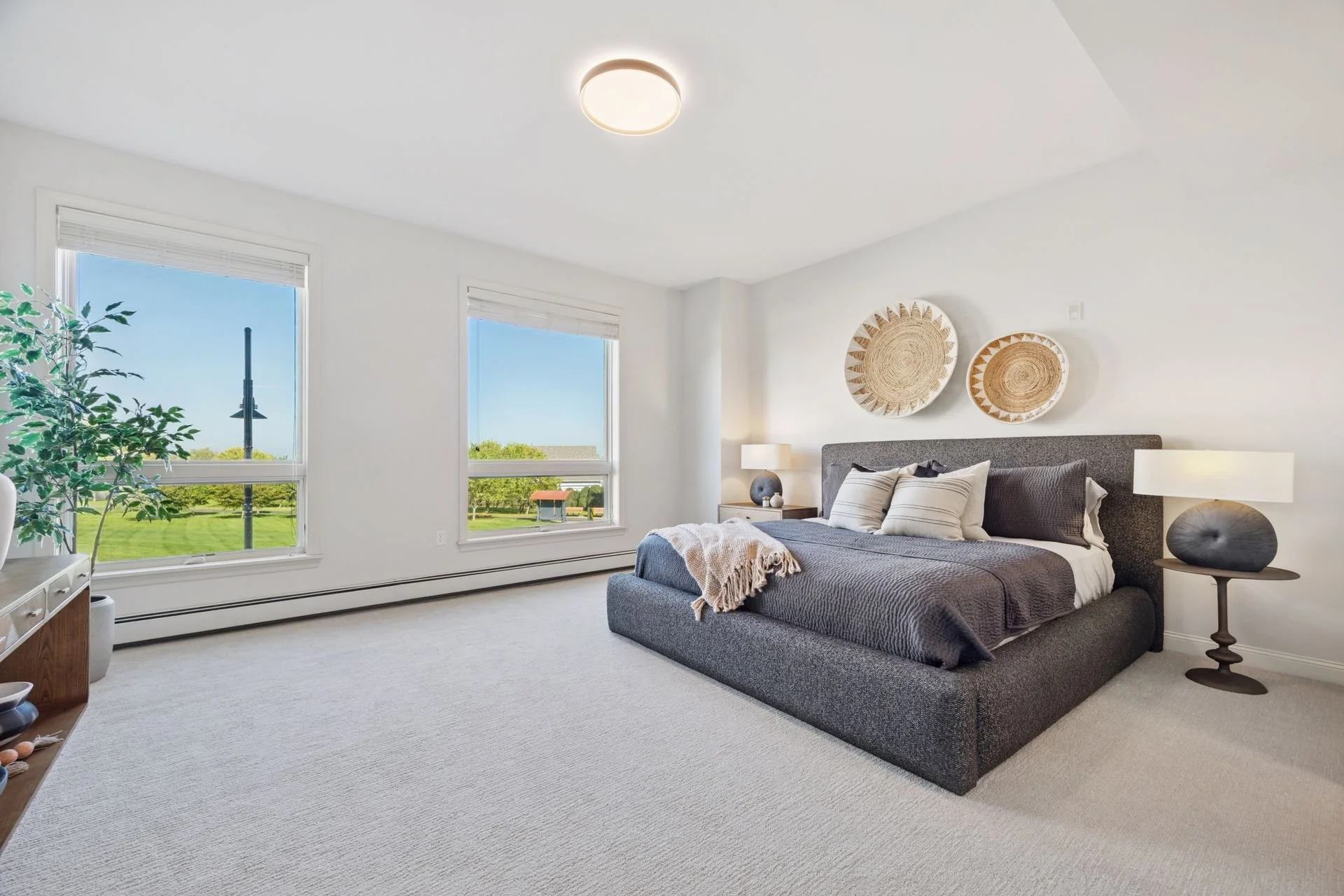 Minimalist bedroom with large windows.