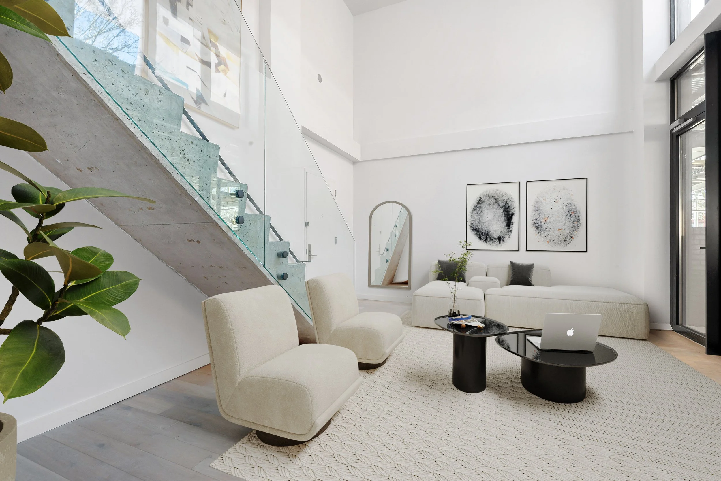 modern townhouse living area with crisp white color palette