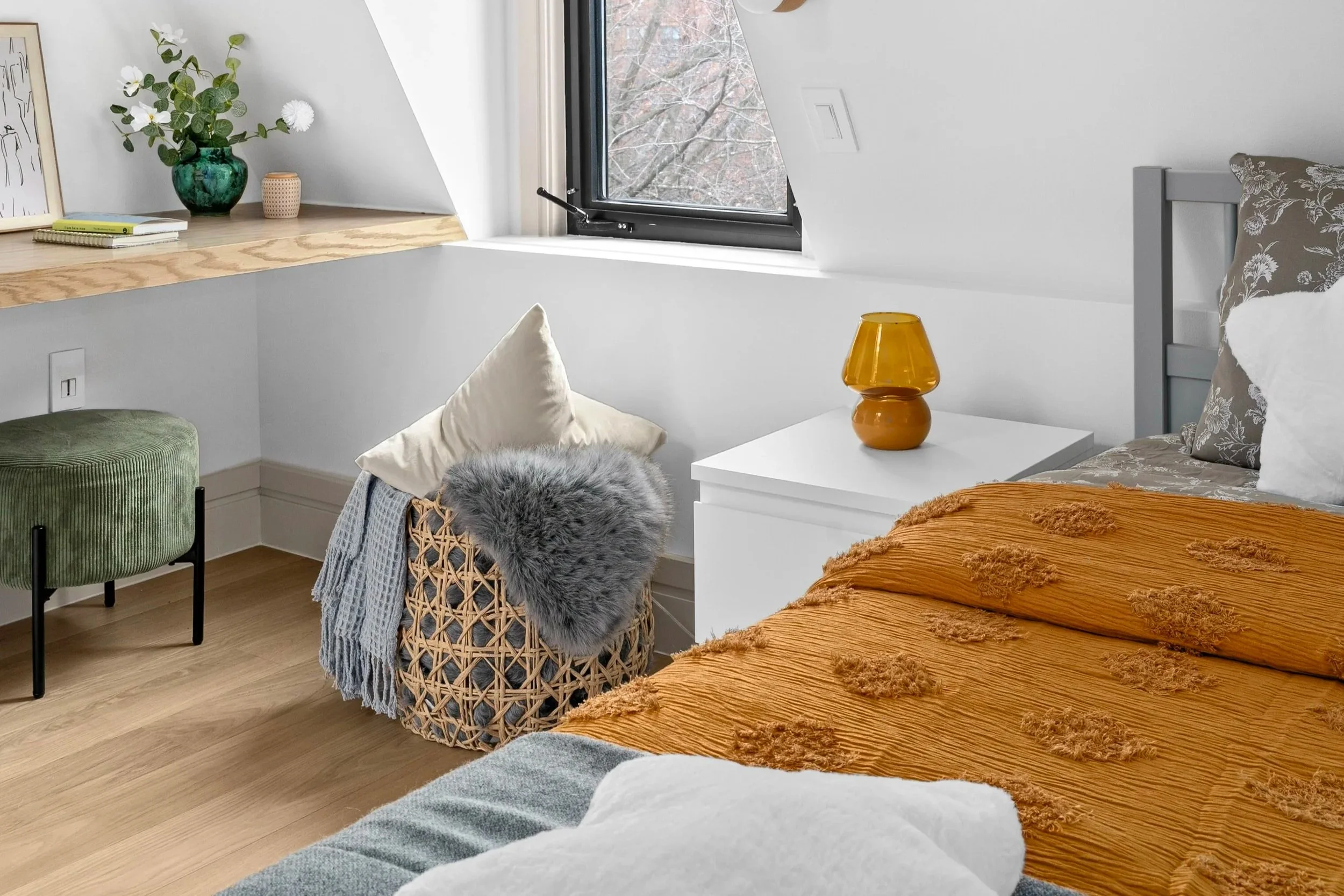 jewel toned childrens bedroom with mustard orange bedding and deep green details