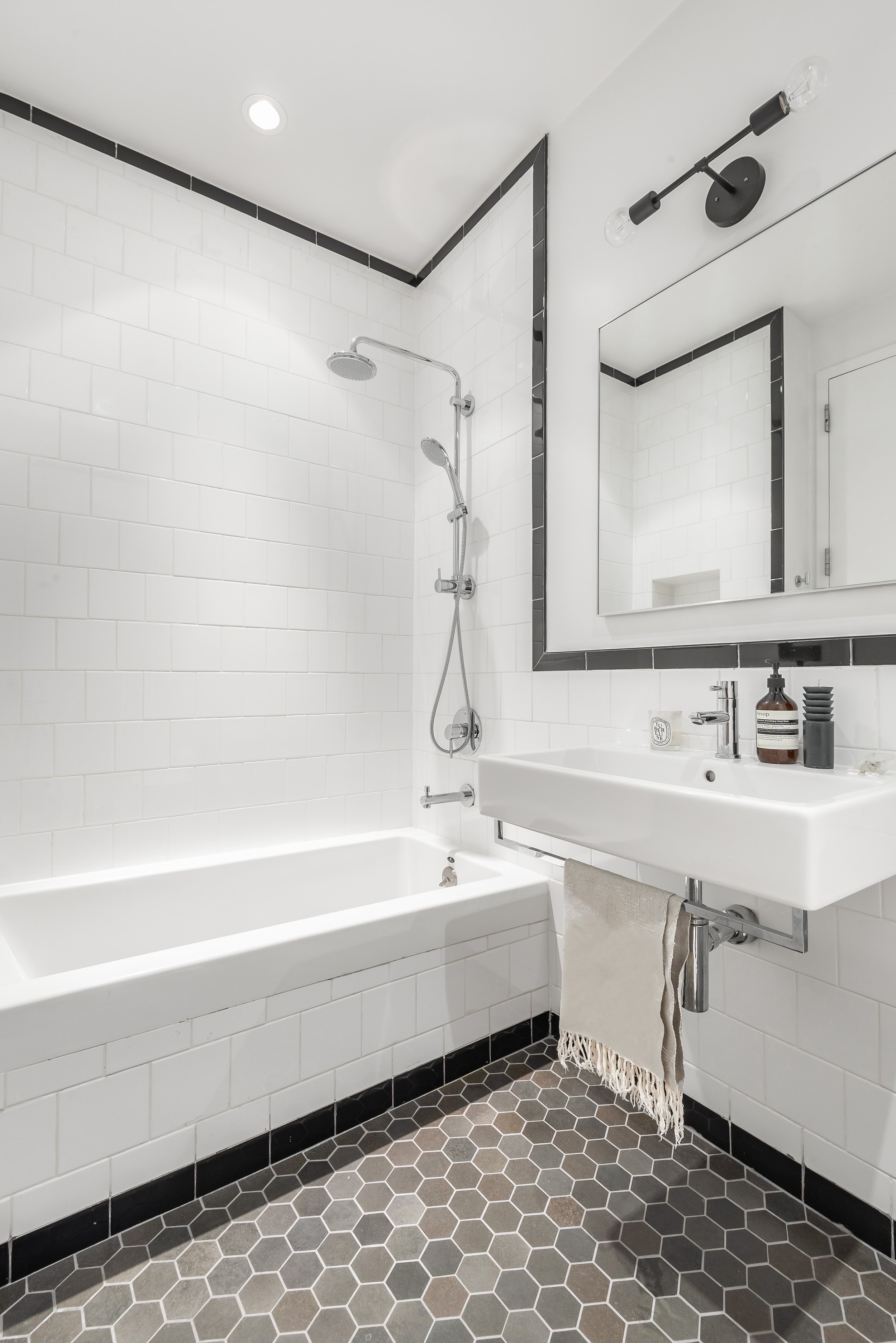 crisp black and white tiled modern bathroom