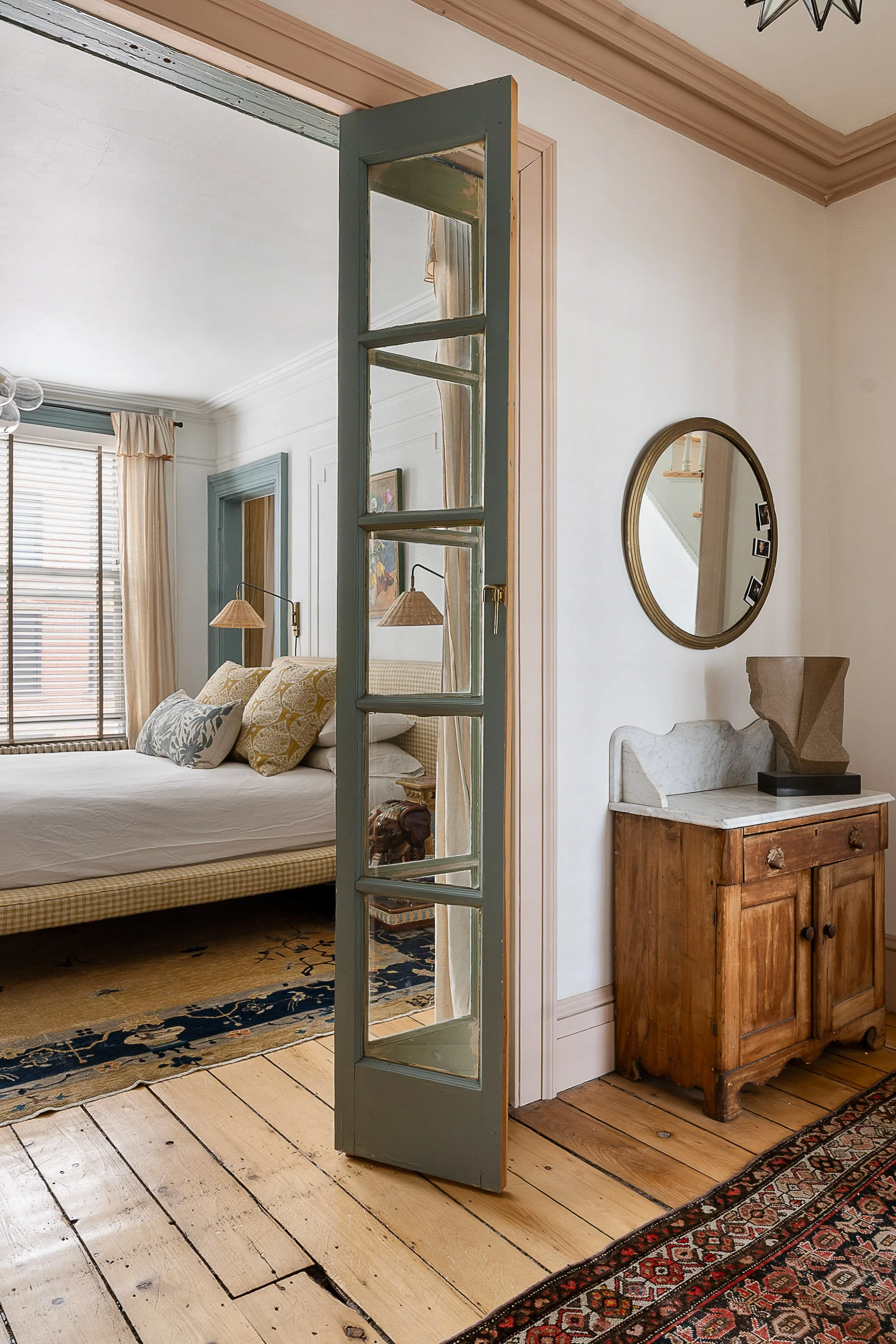 sage green french doors into bedroom