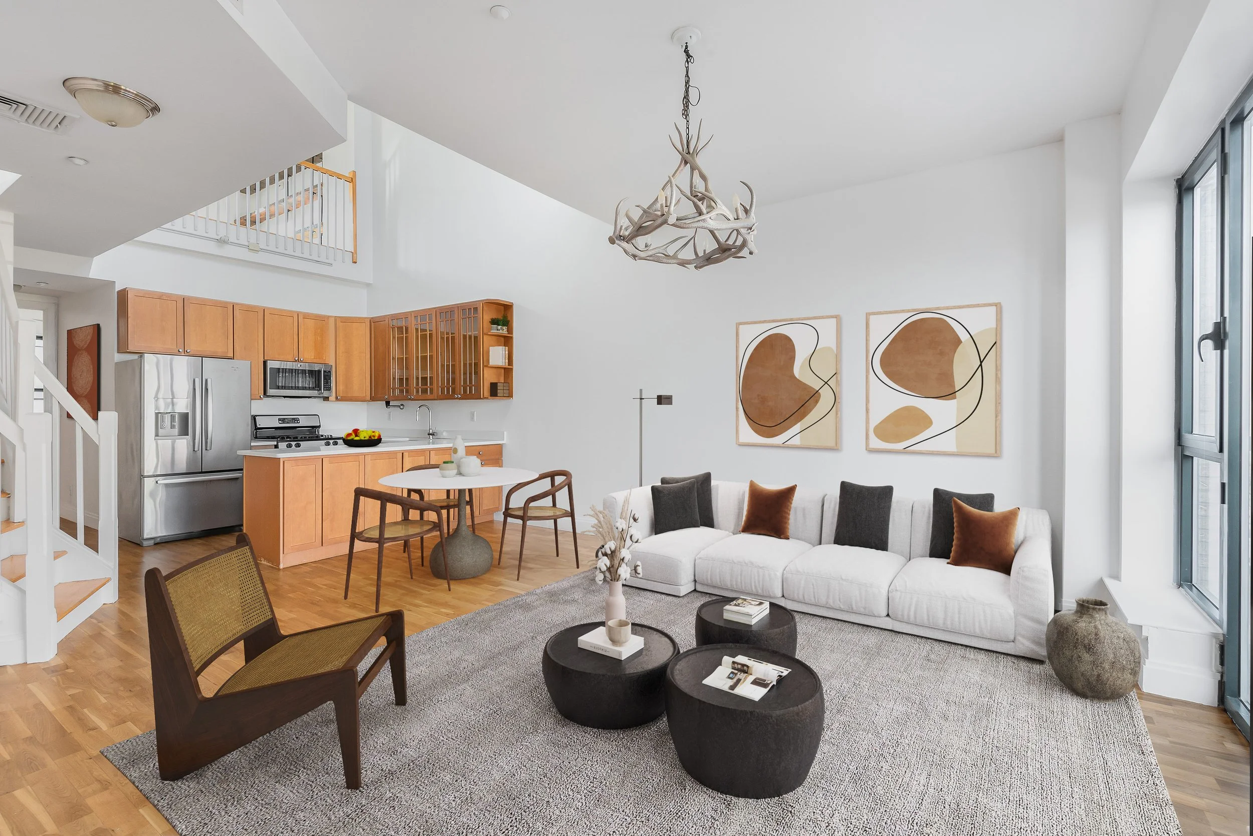 warm neutral living room decor with abstract artwork and unique chandelier