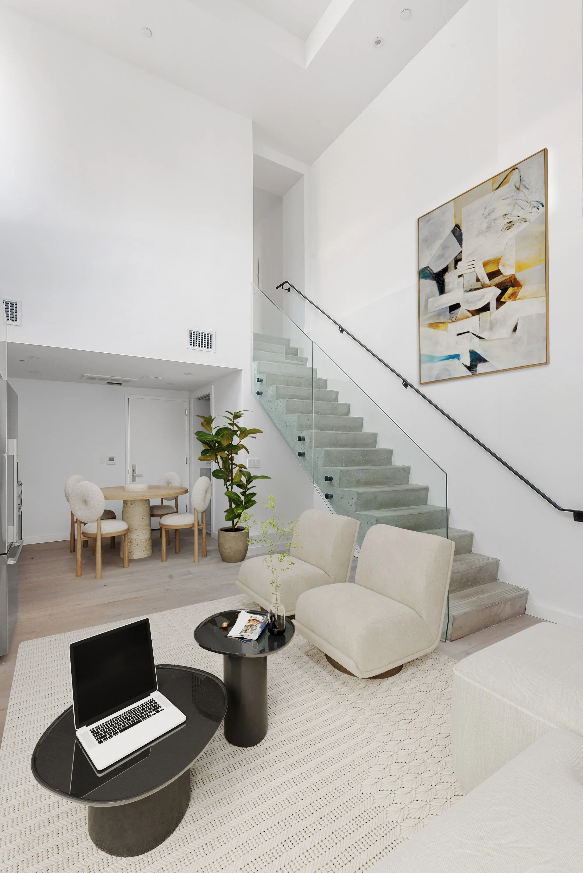 living and dining room space in neutral beige tones
