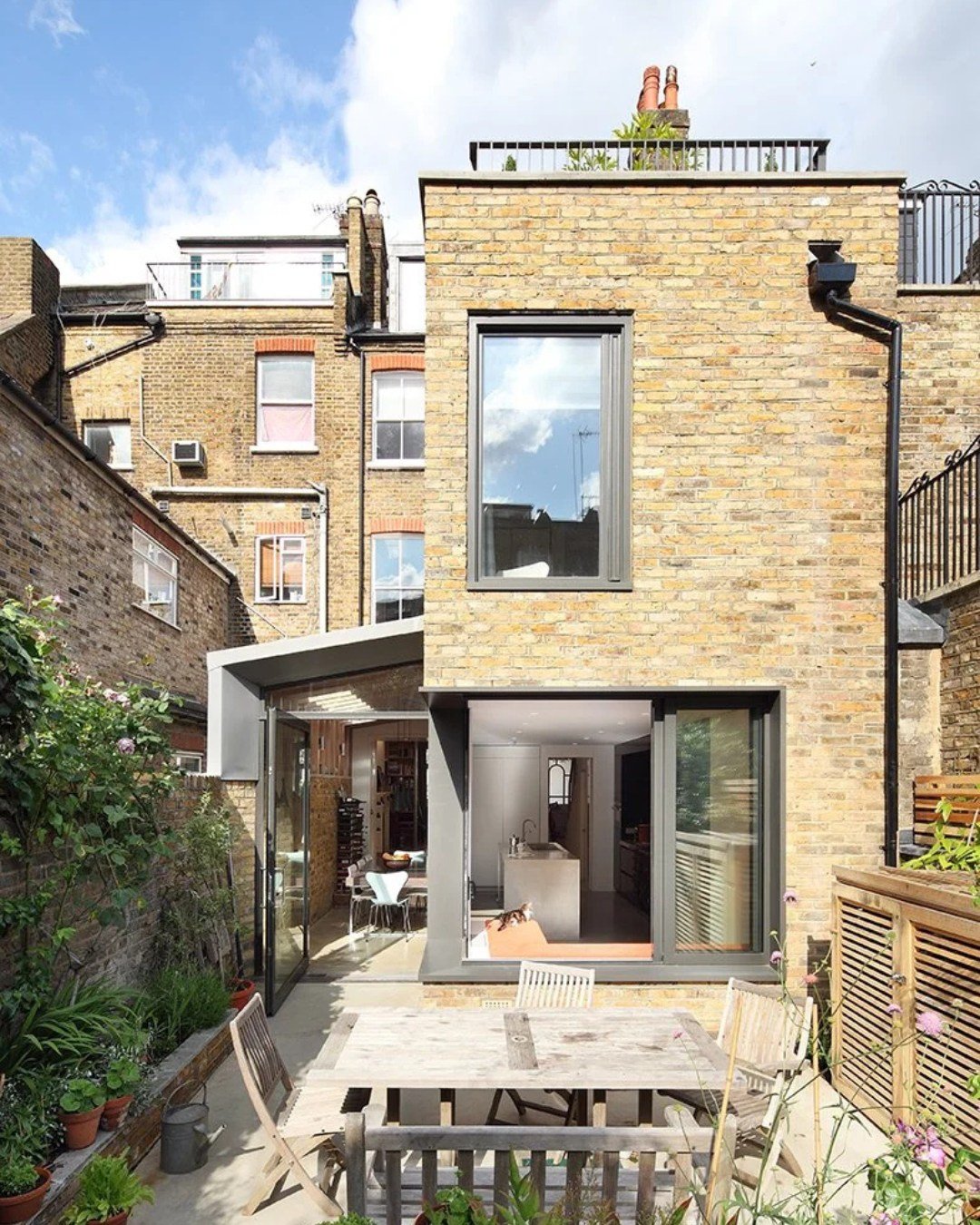 Keep what's good. Add what's missing.

At Book Tower House in Hampstead, the owners wanted to keep the Arts and Crafts details they'd inherited, not paper over them. So the contemporary work sits alongside, clearly of its own time.

To the rear, a si