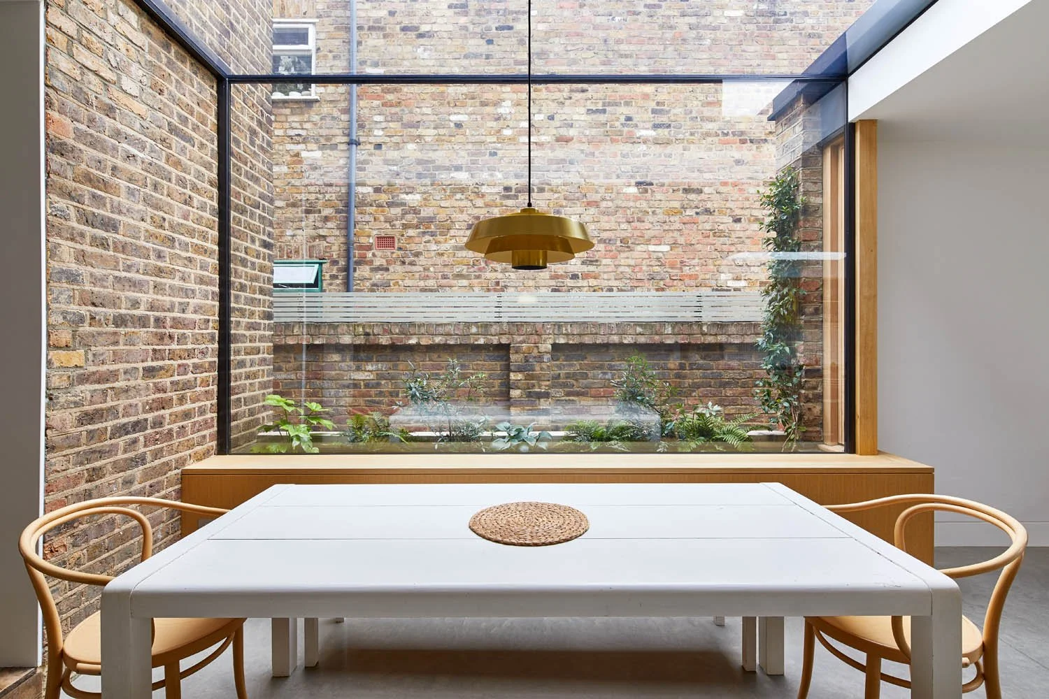 View across table to expansive glass at Notch House