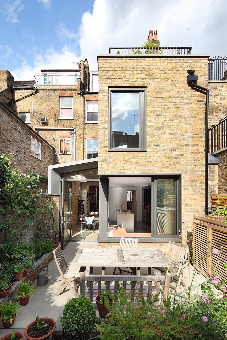 Garden view of side extension with window seat in Hampstead