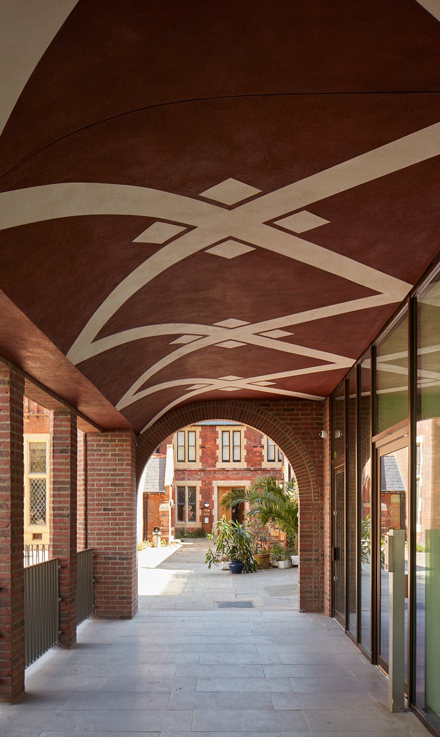 Arched walkway towards historic Toynbee Hall
