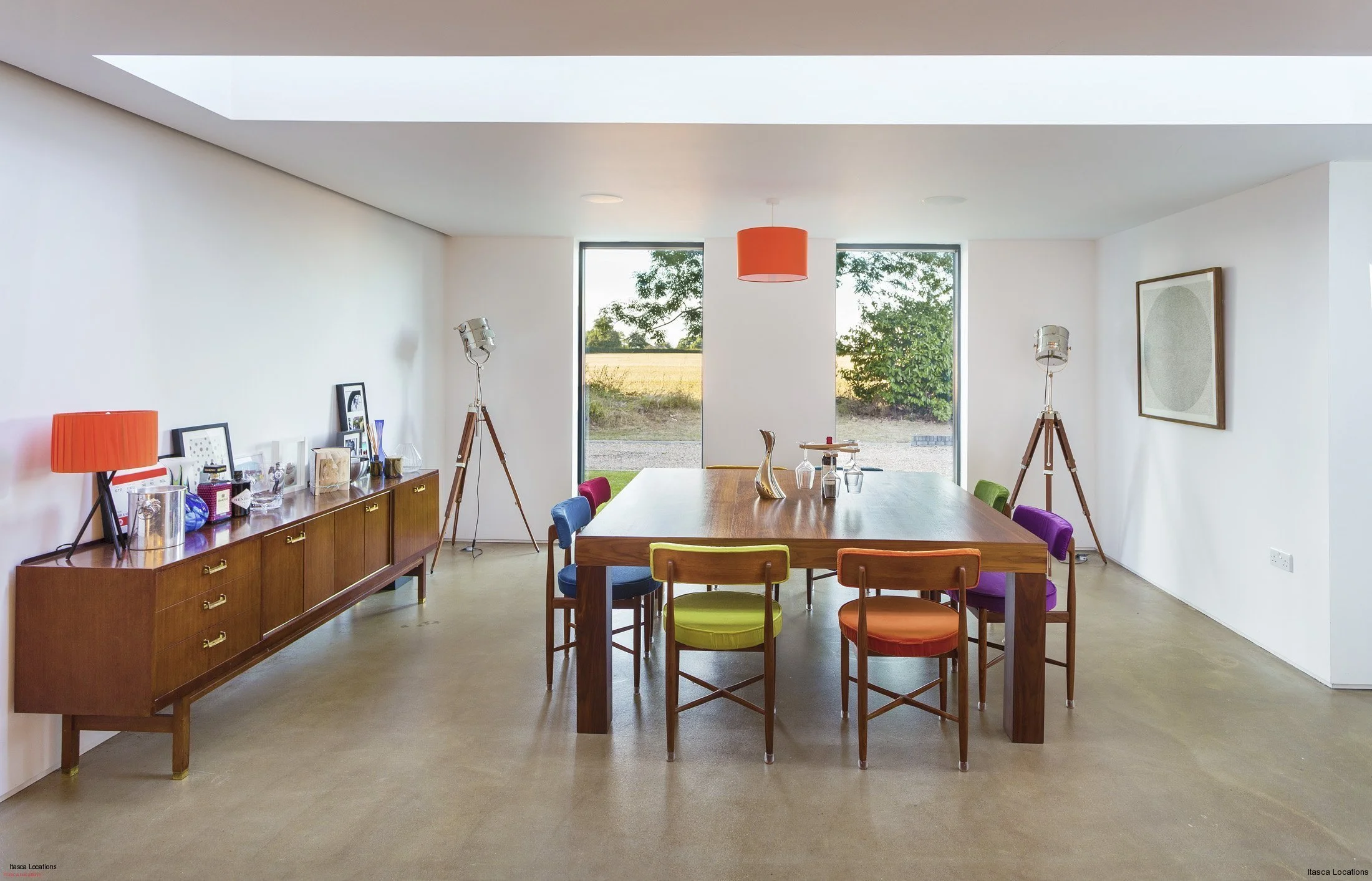 Minimalist dining area with countryside views