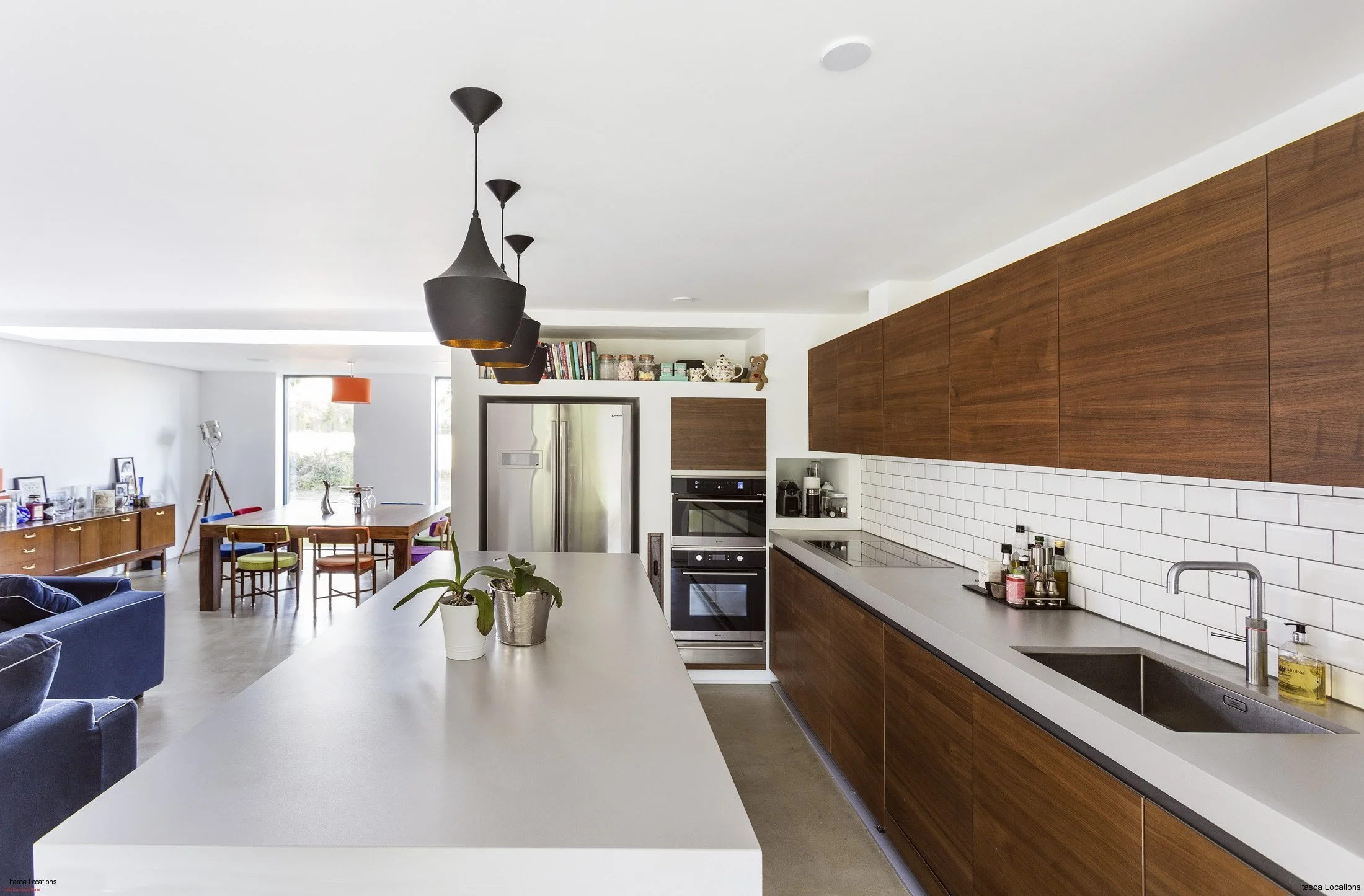 Kitchen with large island and open-plan living area