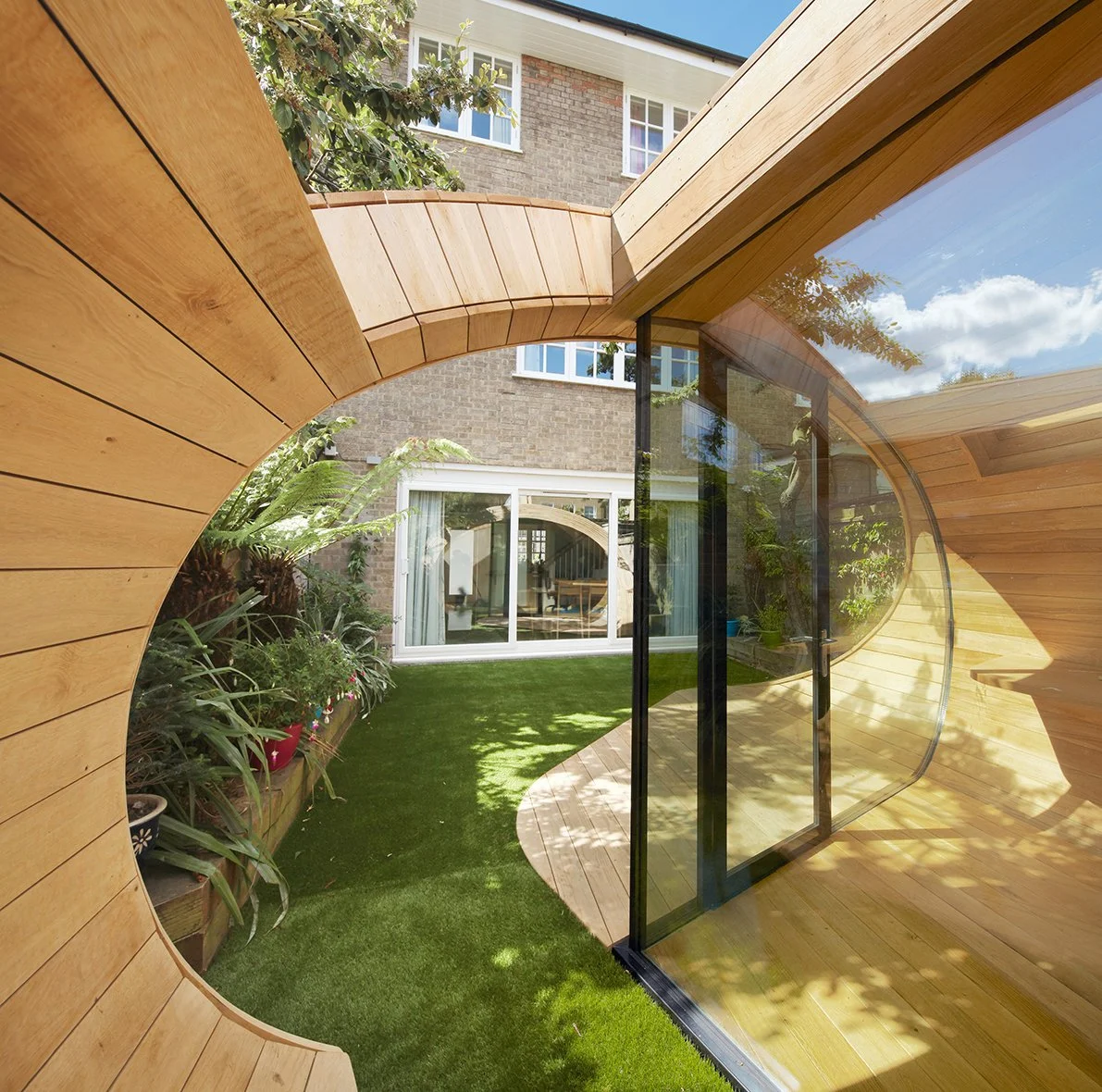 Glass and timber garden structure London