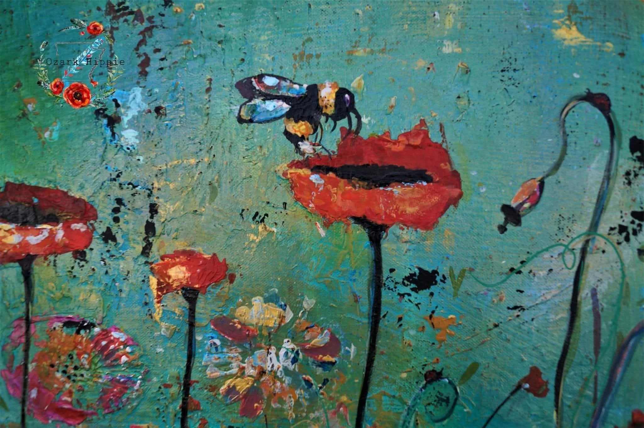 An art piece with a bee on a poppy with a blue background