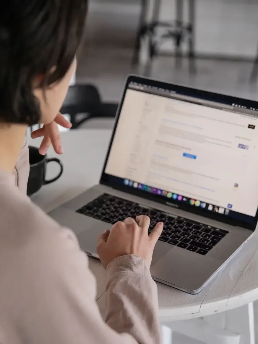 A professional women using a laptop at home.