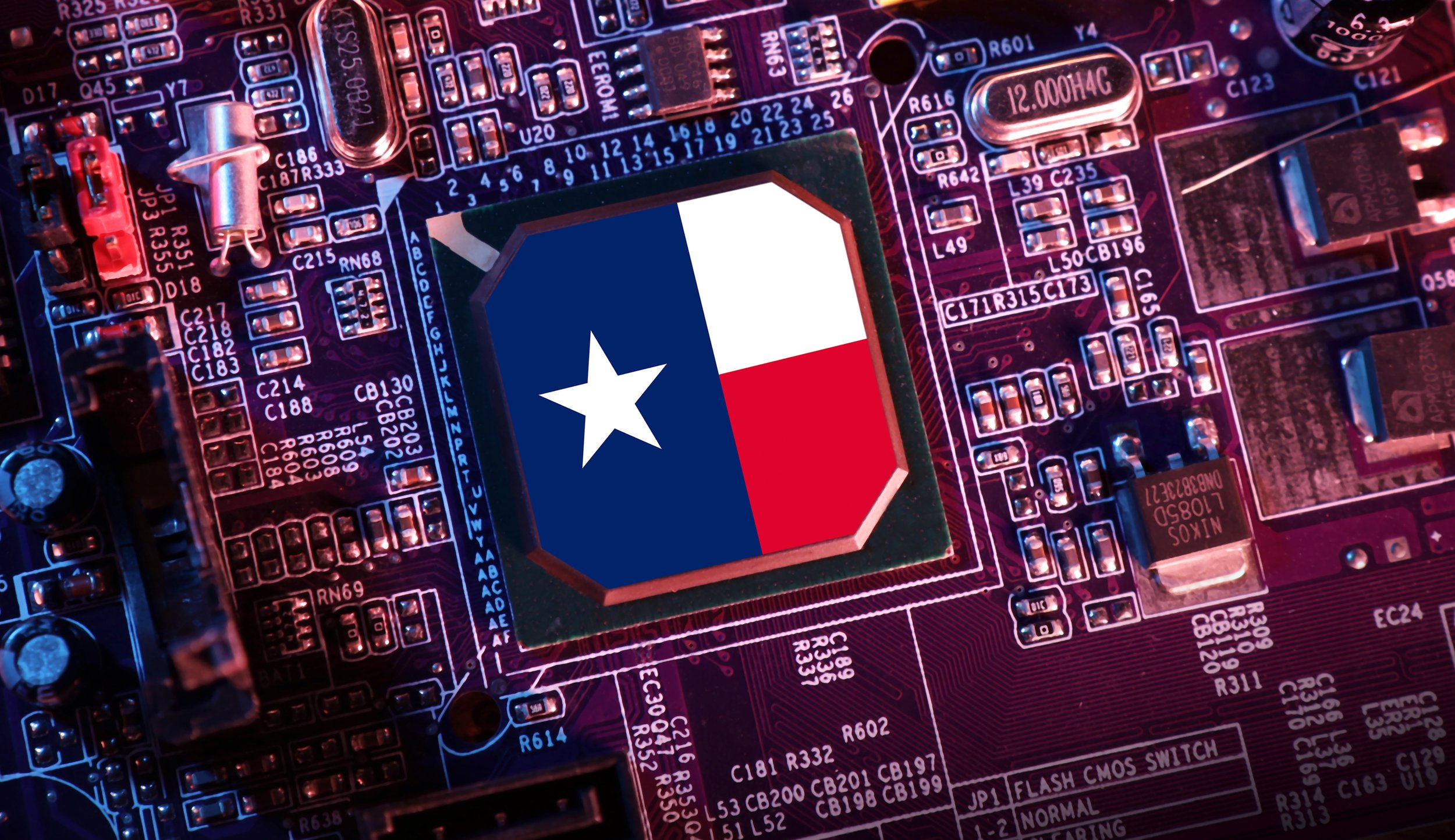 A close-up of a computer motherboard with a CPU chip branded with the Texas flag.