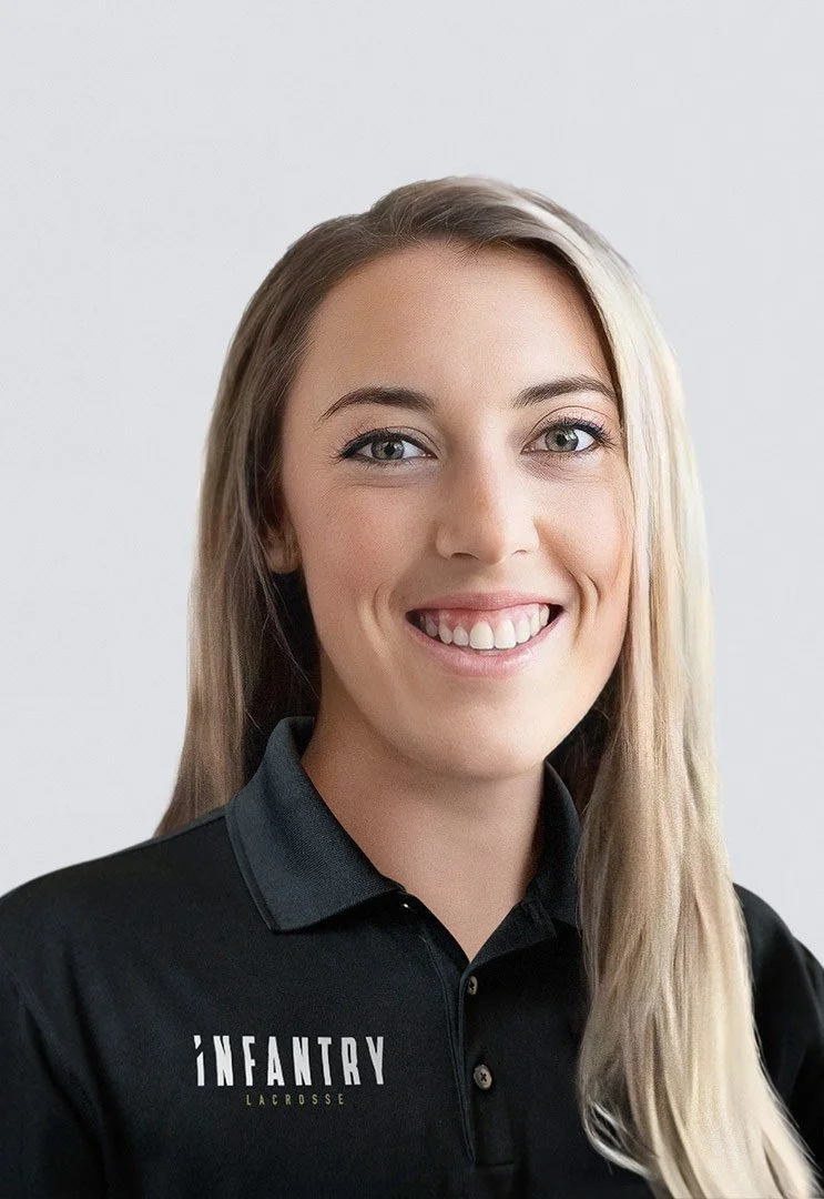 Smiling woman in black polo shirt with "INFANTRY LACROSSE" text.