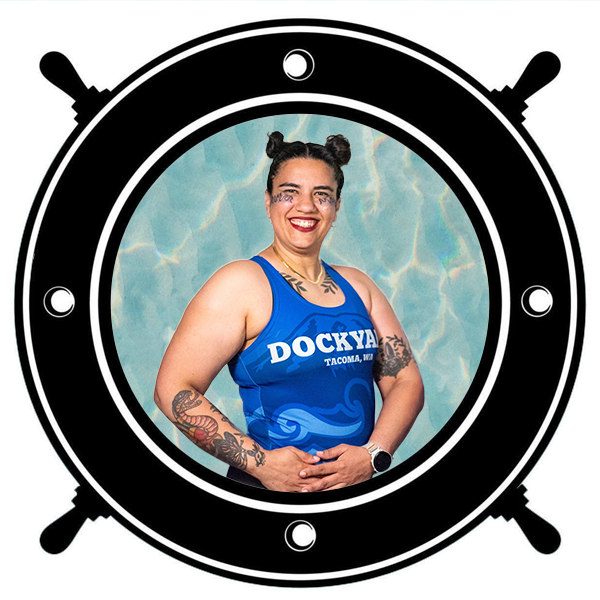 A woman in a blue sleeveless sports jersey seen through a circular porthole.