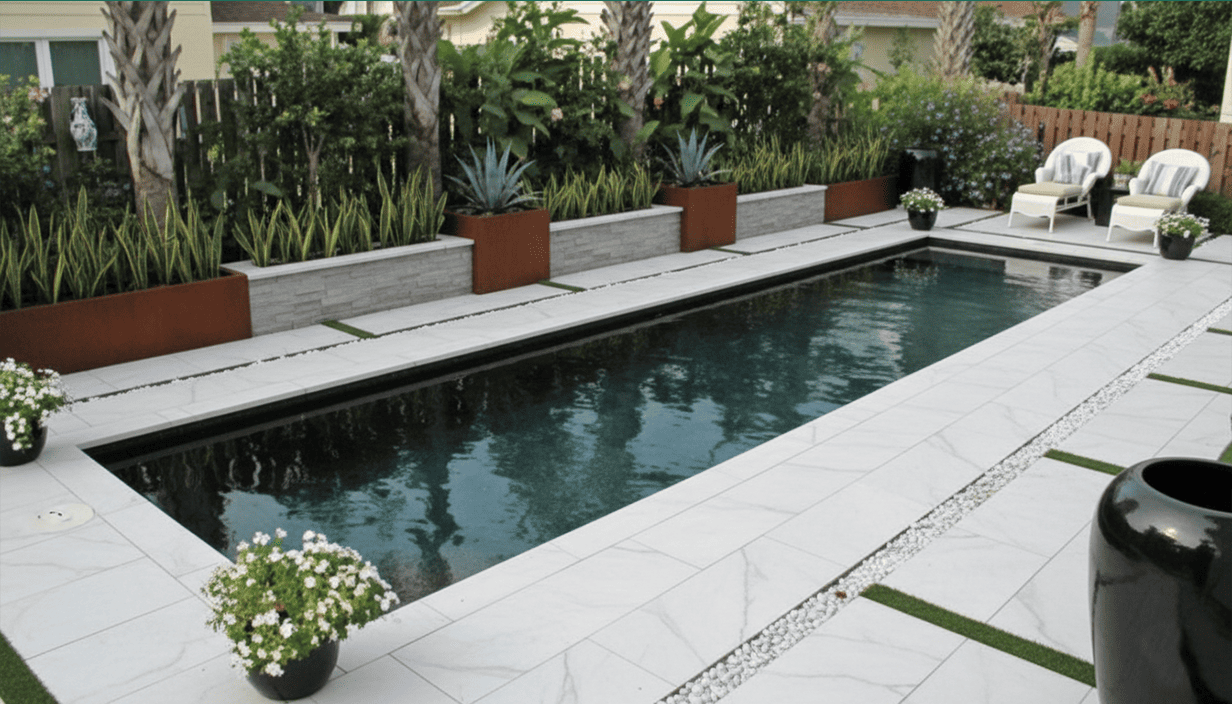 A backyard swimming pool surrounded by tile and greenery with patio chairs and potted plants.