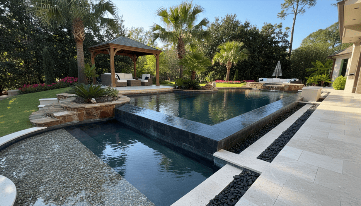 Luxury backyard with a large swimming pool, hot tub, and surrounding tropical landscaping including palm trees, shrubs, and flowers. There is a gazebo with outdoor seating on a patio area, and additional seating with a table under an umbrella in the 