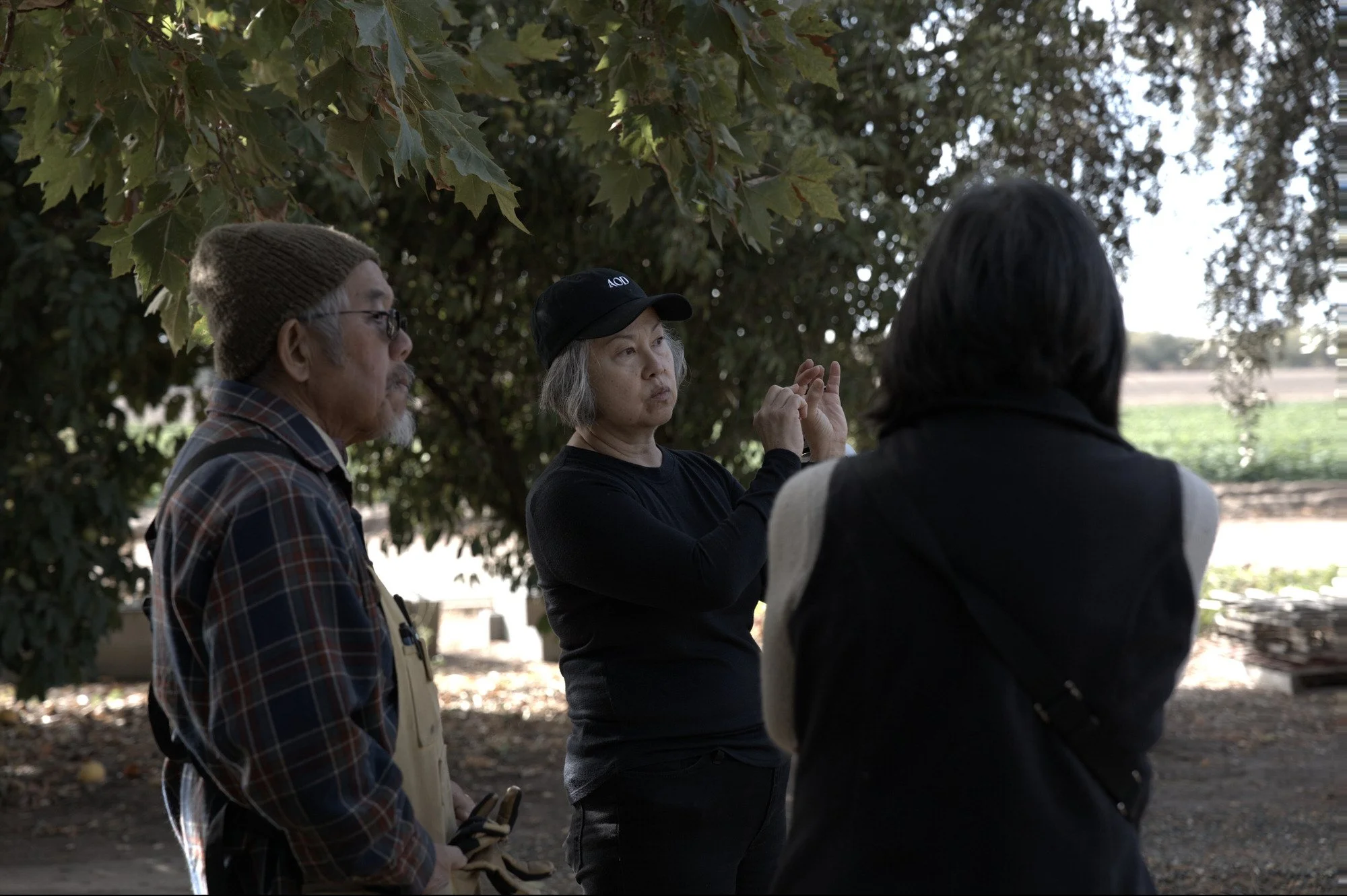 Karina explains a scene to Yoshi’s son Dan Kubo and his wife Chris.