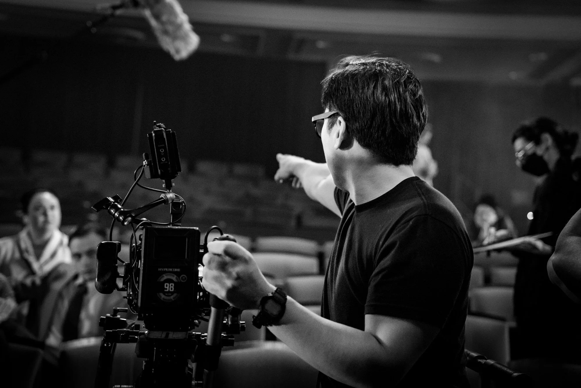 Cinematographer Jason Wada sets up for a movie theater scene. 
