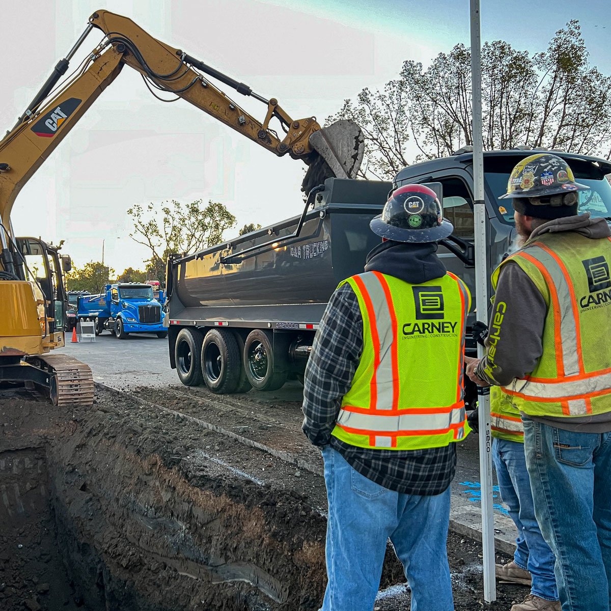 carney engineering construction digging trench installing underground utilities