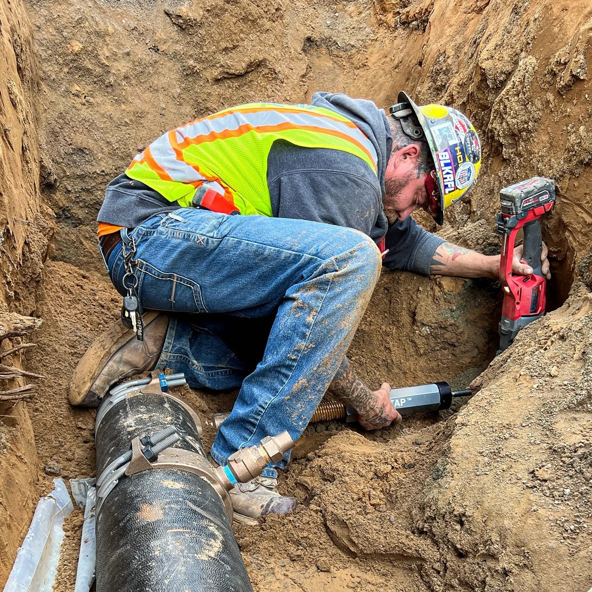 carney engineering construction employee installing underground utilities
