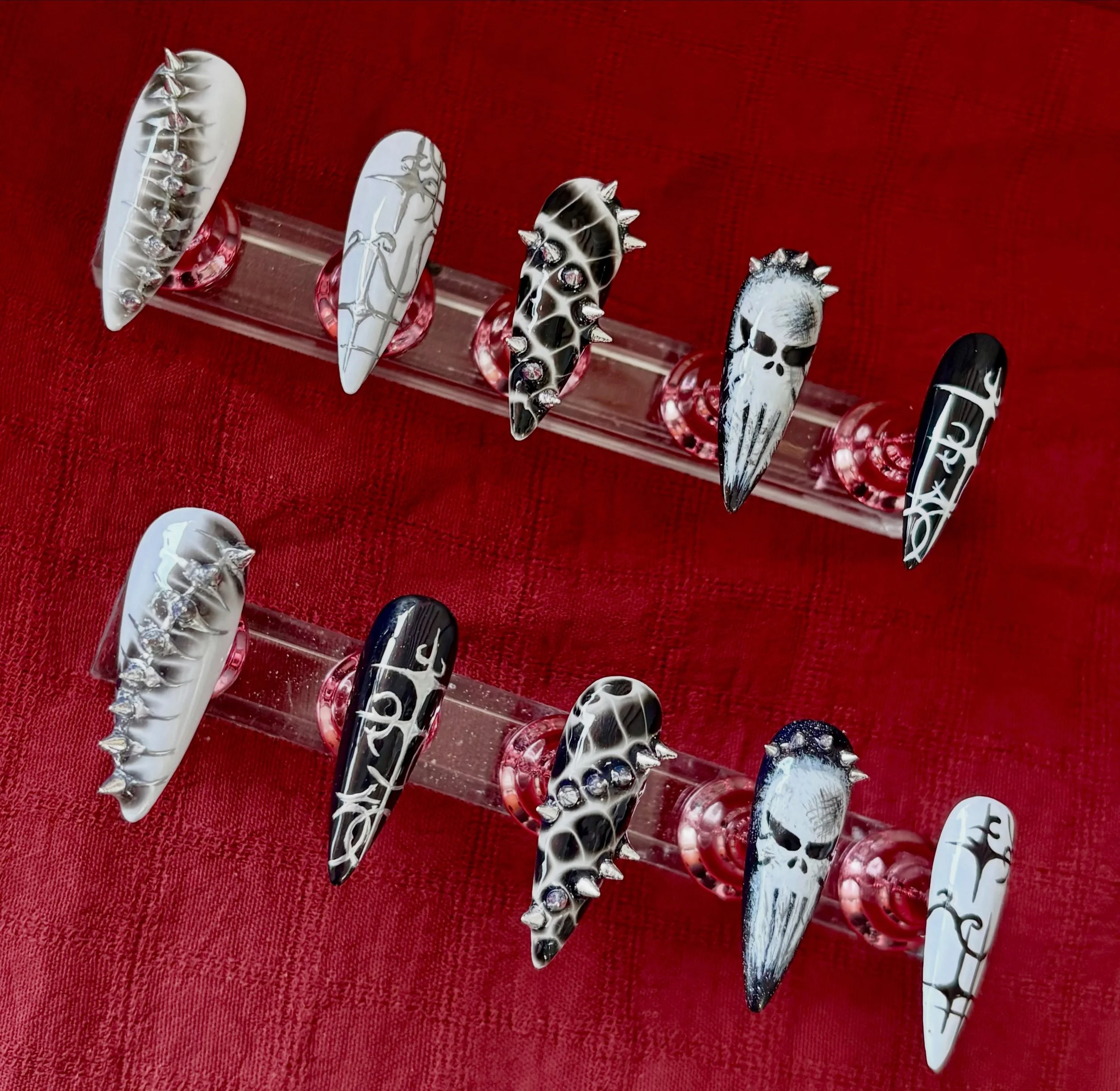 The Punisher inspired Gel-X set with a fierce twist! 💀🖤❤️