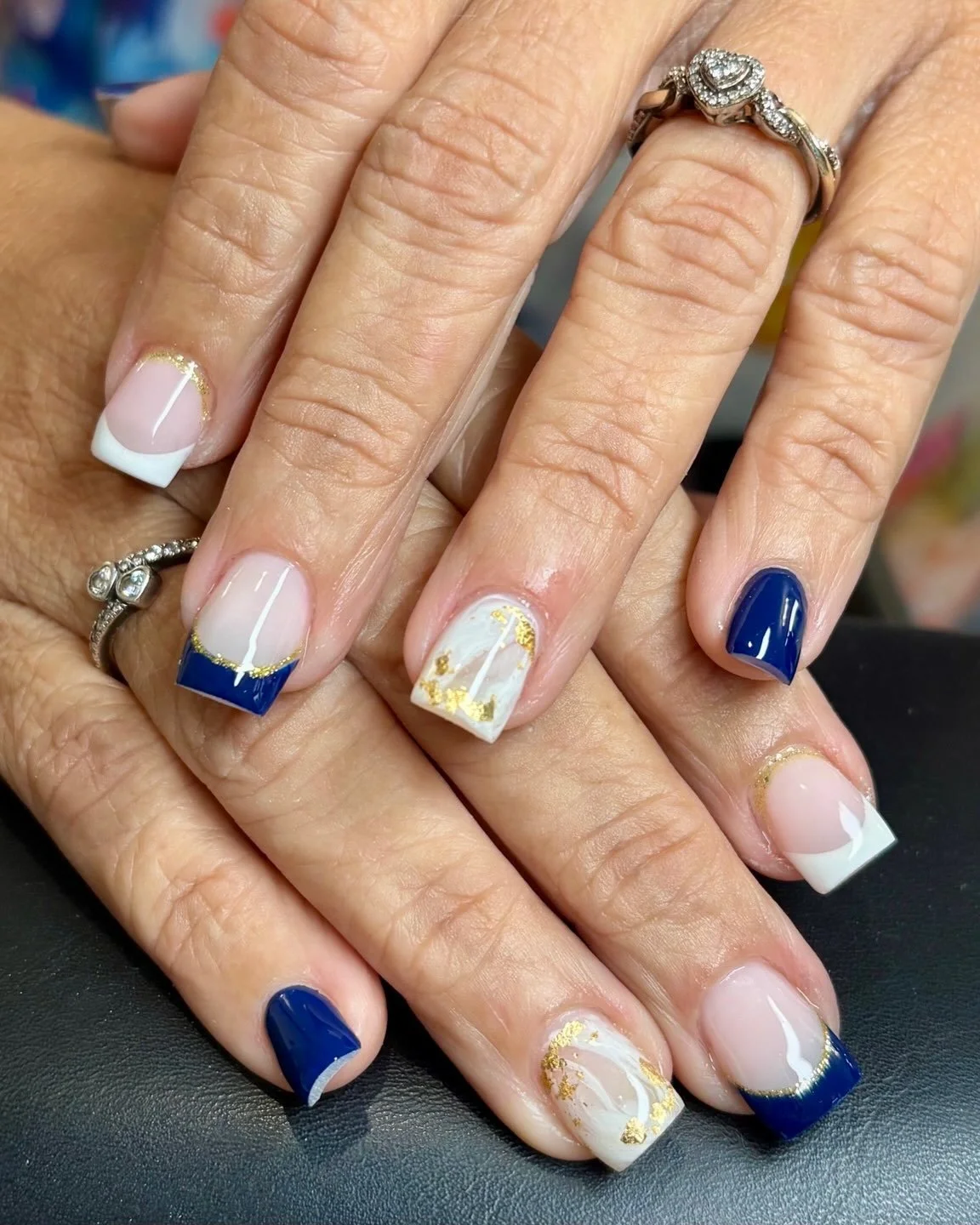 Navy blue, crisp French tips, and delicate gold accents. ✨💙 A little marble, a little shimmer, and a whole lot of elegance.