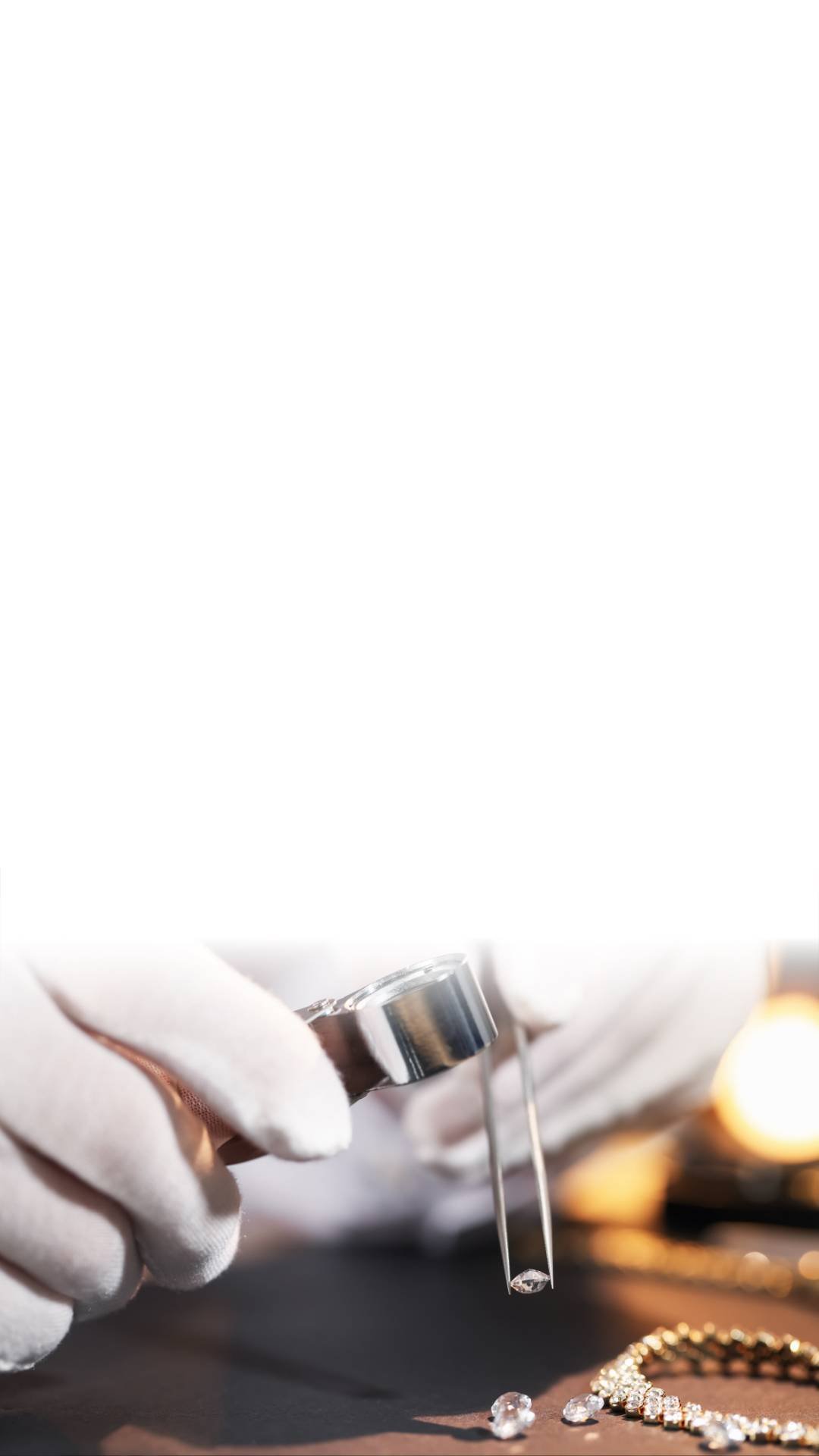 Jewelry being handled with tweezers, including earrings and a necklace, with a gloved hand using a tweezer.