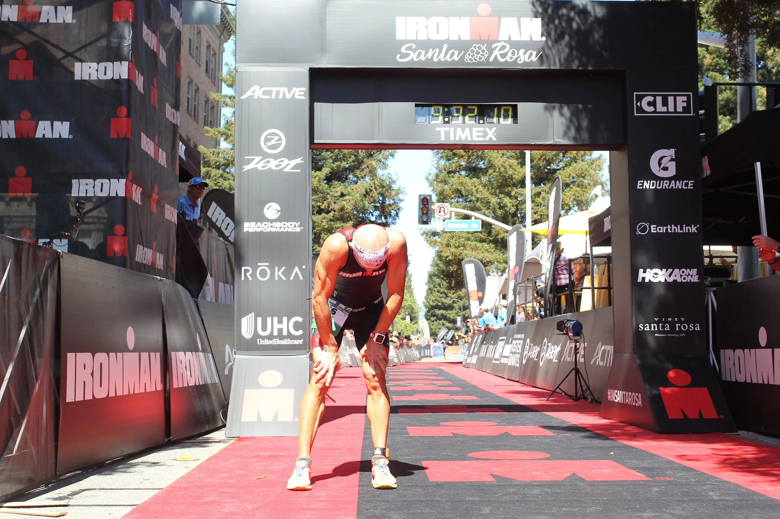 Adam Hill at the finish line of an Ironman race in Santa Rosa, California