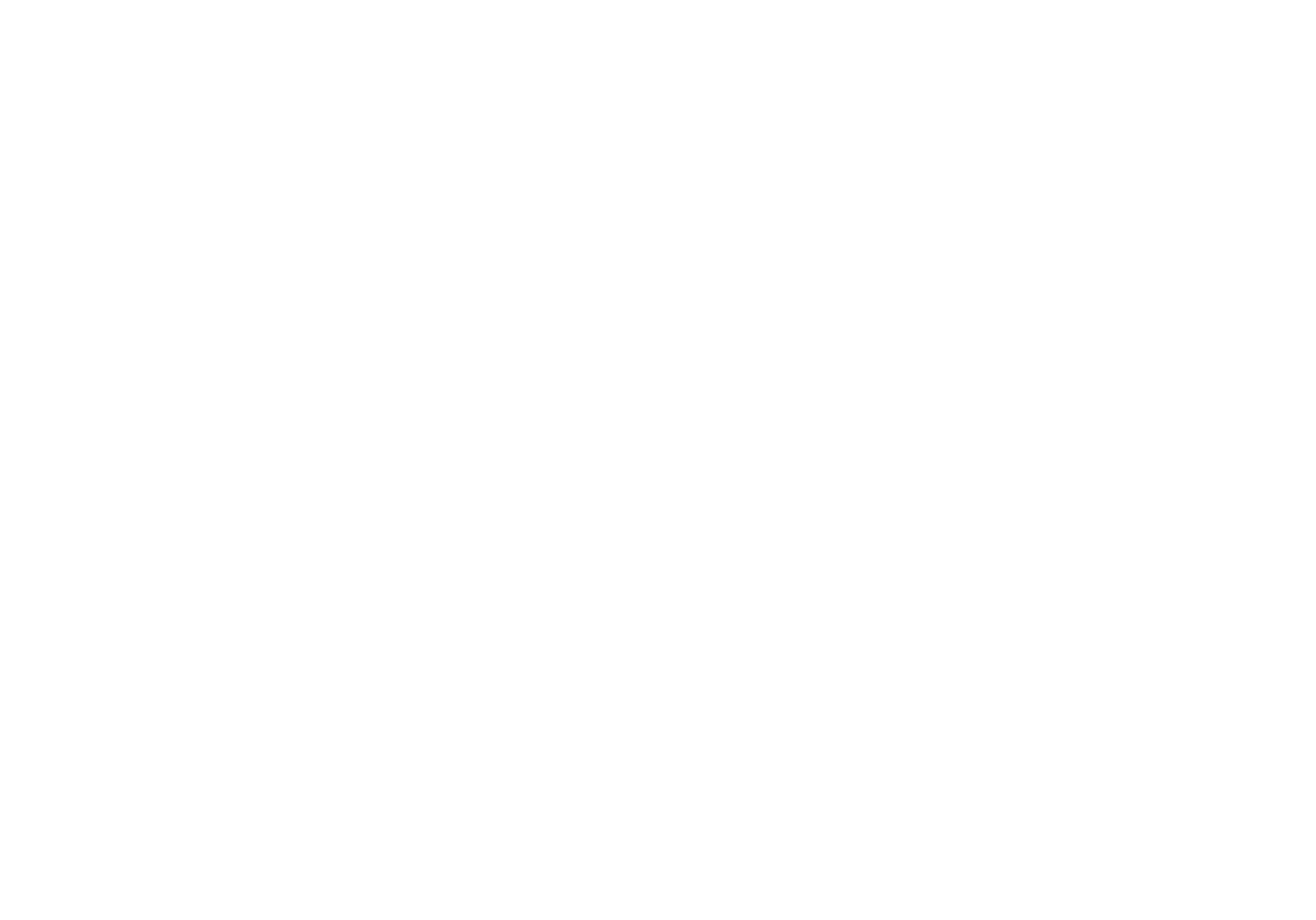 Brooklyn modern medical office reception area with a large curved sofa, a desk with a computer, a chair, and a tall potted plant.