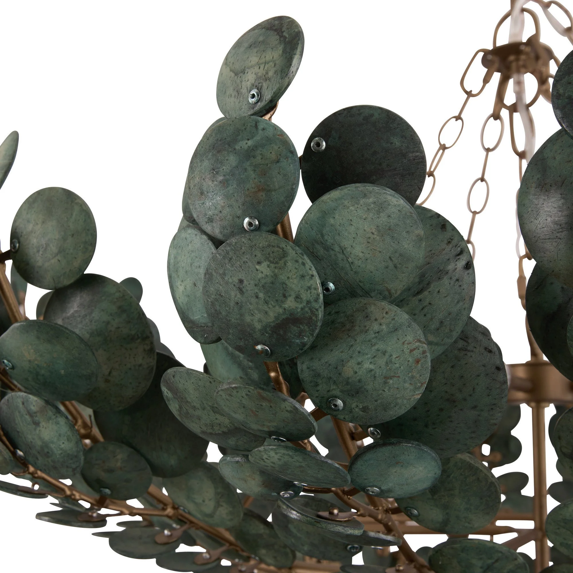 Close-up of a decorative chandelier with green, round, stone-like discs attached to copper-colored metal branches.