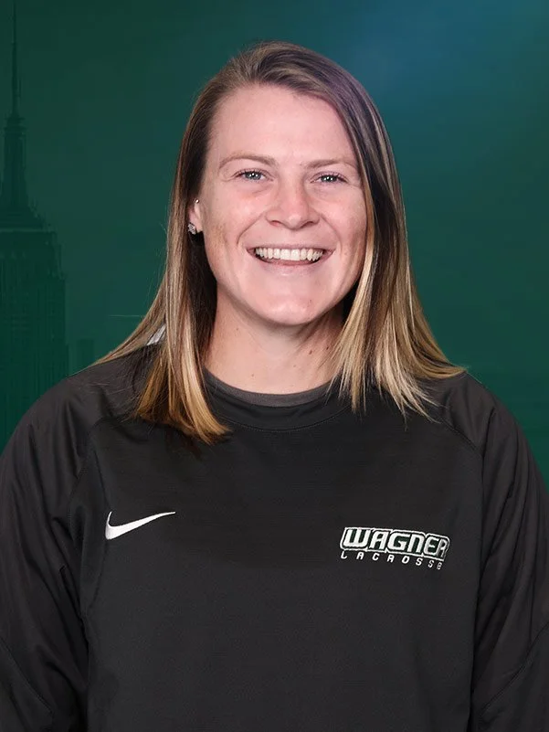 Smiling person wearing a Wagner Lacrosse sweatshirt against a green background.