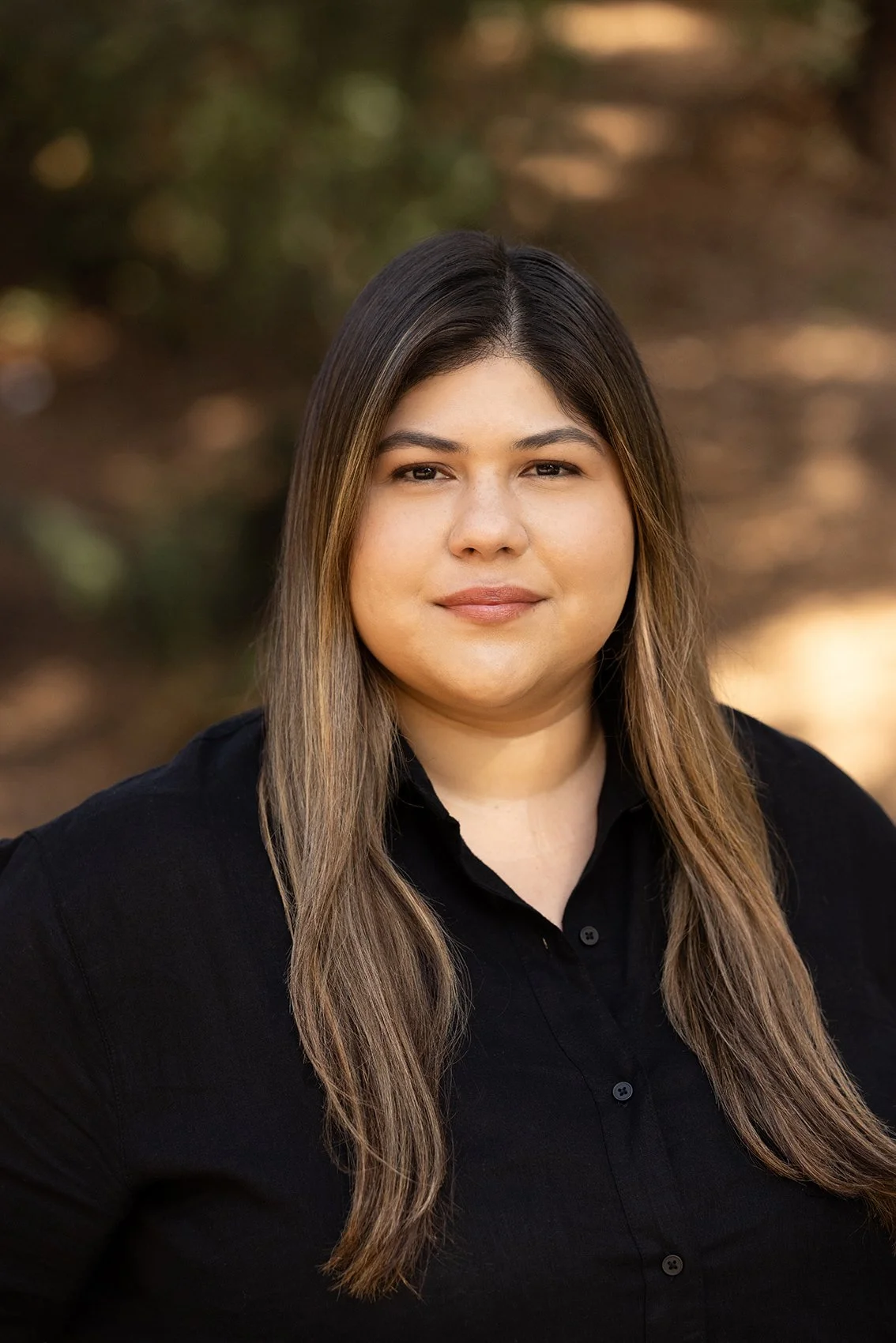 Dafne, Project Manager at Casa Bonita Builders, standing outdoors, representing hands on project leadership and detailed execution in custom home remodeling projects.