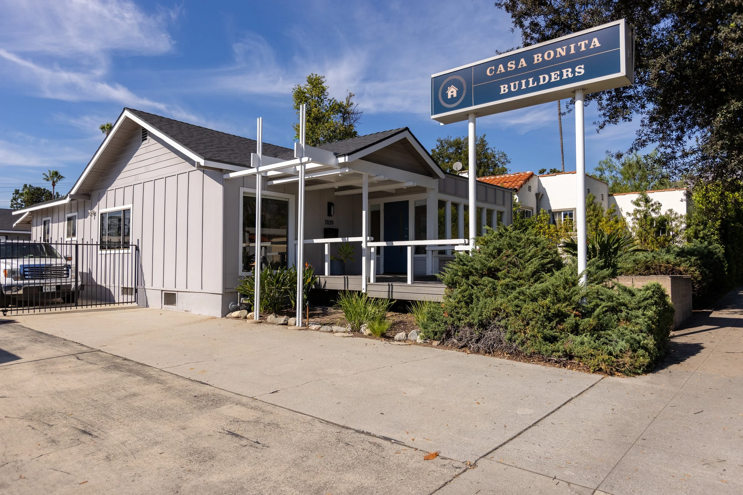 Casa Bonita Builders office in Pasadena, CA with welcoming porch, landscaped garden, and onsite parking, showcasing a professional design build construction studio open to clients.
