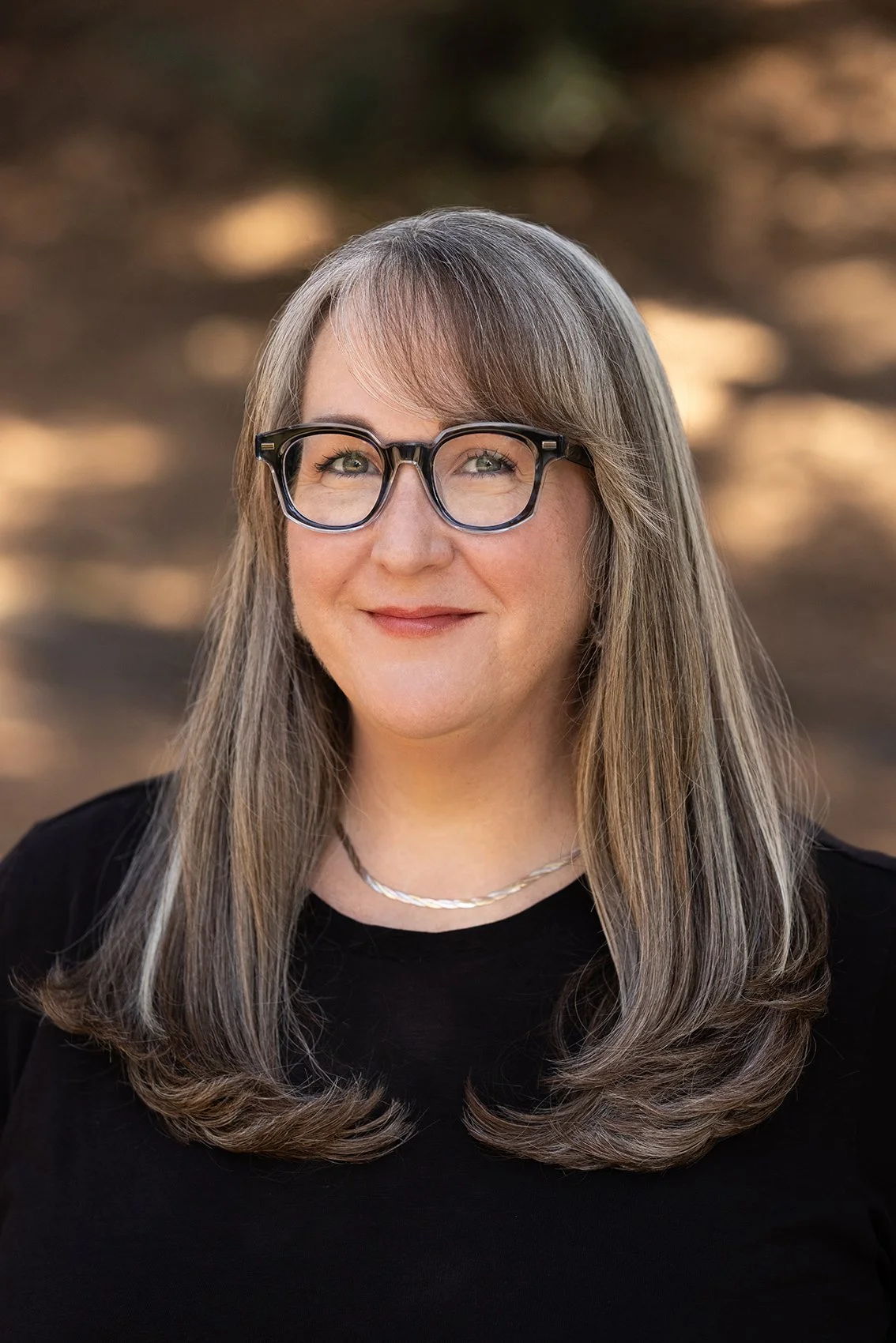 Sarah Hamilton, Director of Operations at Casa Bonita Builders, outdoors in Pasadena, representing project coordination, design oversight, and client communication in residential construction.