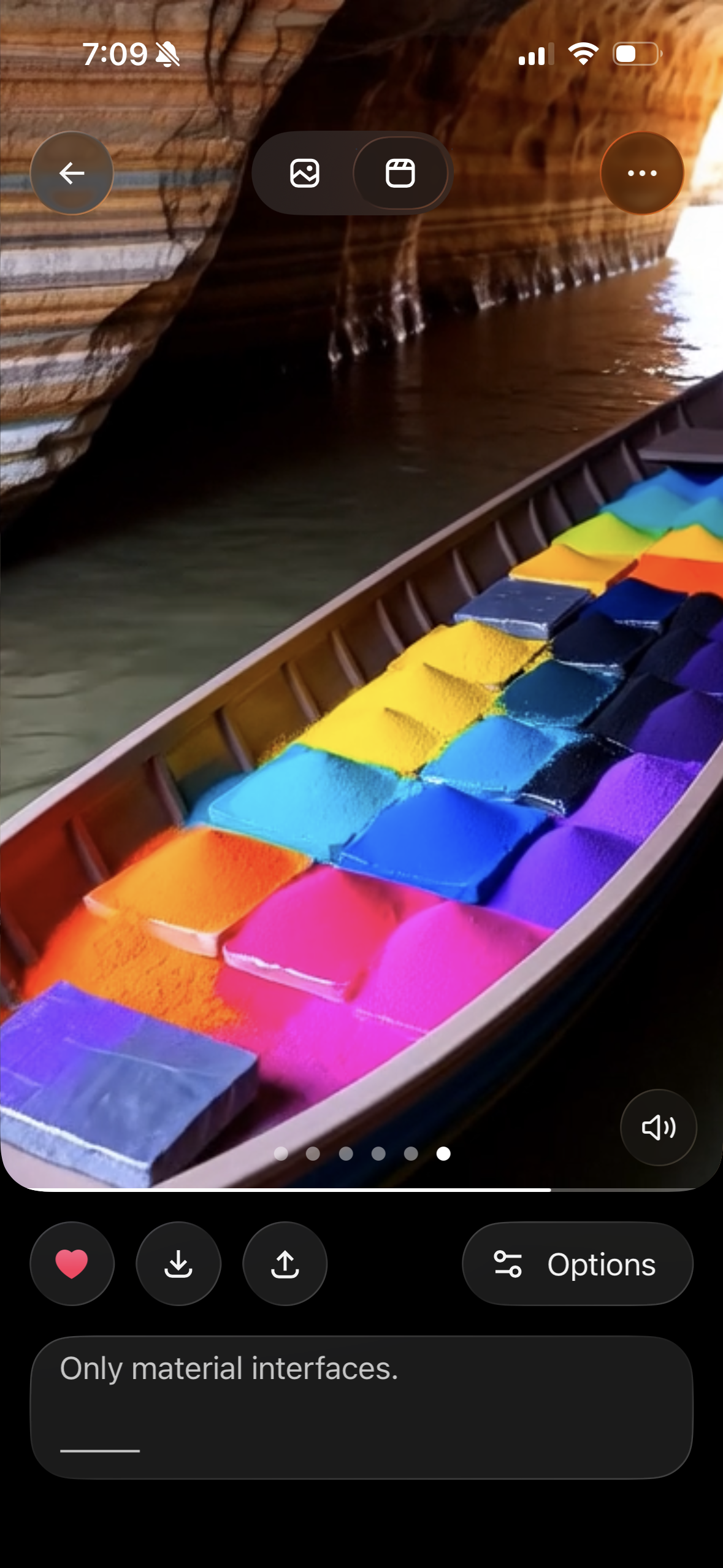 Colorful chalks in a boat near a rocky canyon wall.