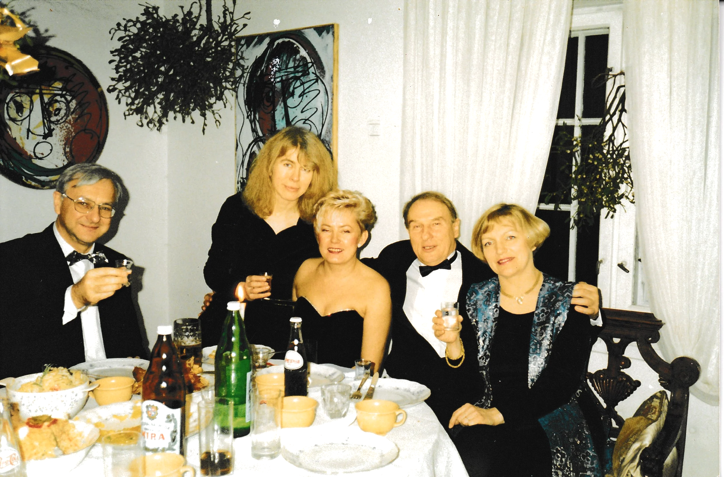 Rozyny Nina with guests at an annual Karanival, Marek Model Art Exhibit on wall