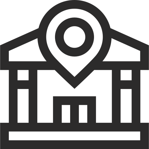 Line drawing of a building with a large circular feature at the top, resembling a clock or emblem, and a sign with text underneath.
