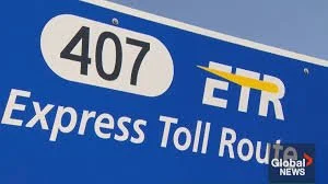 Blue highway sign for Interstate 407 Express Toll Route with ETR logo.