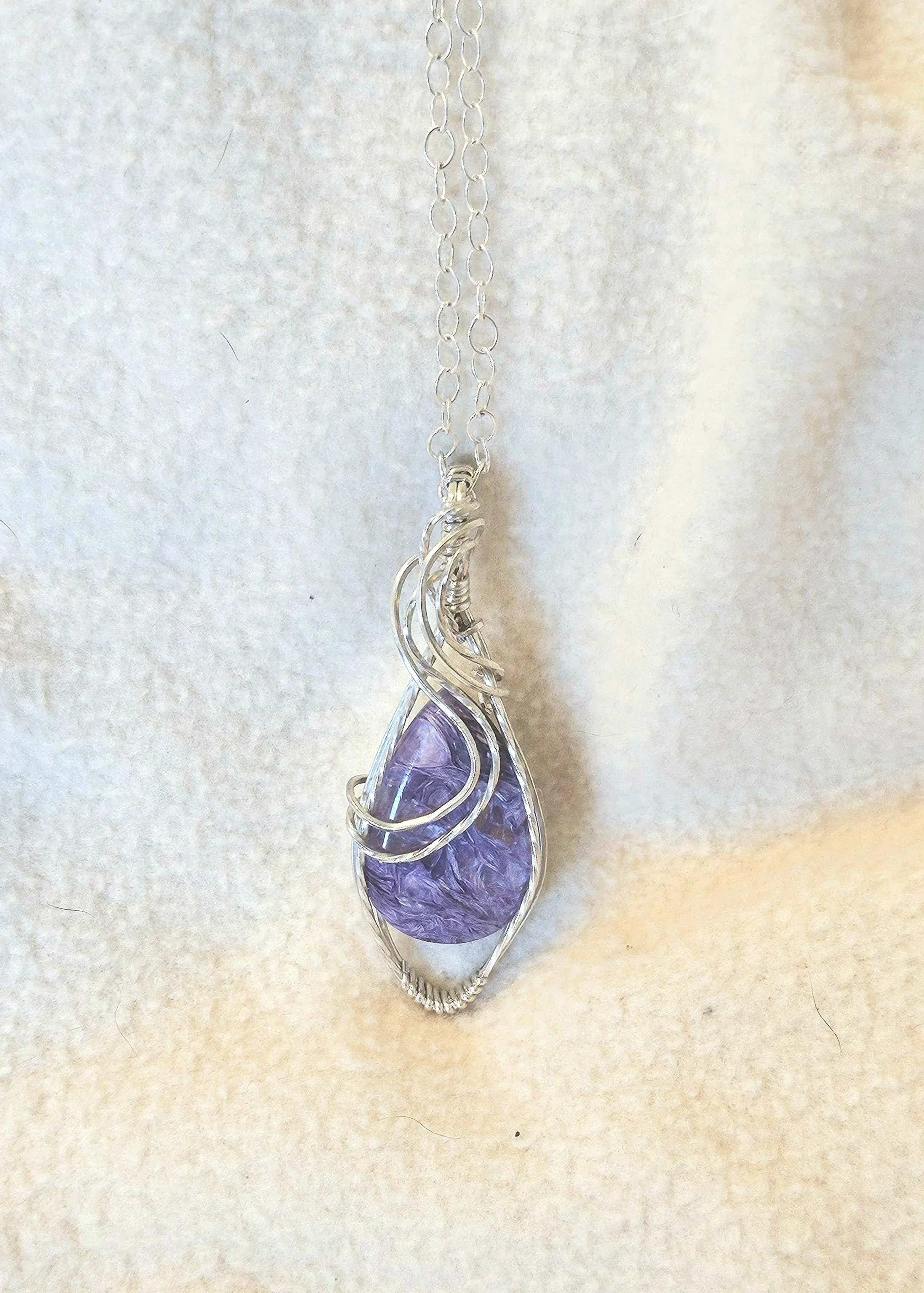 Charolite wrapped in Sterling Silver with a SS chain